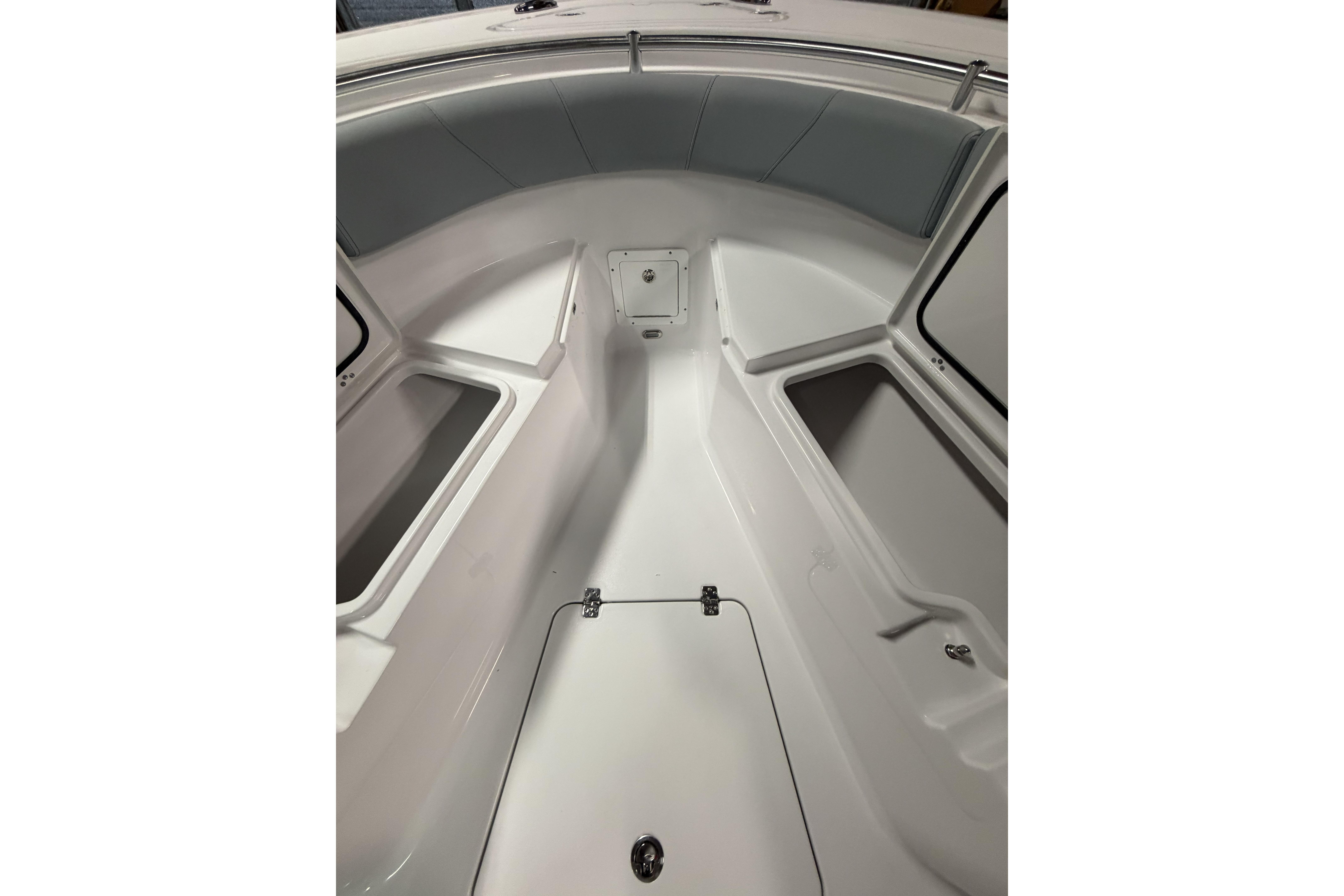 2026 Sportsman Open 232 Center Console boat interior with storage compartments.