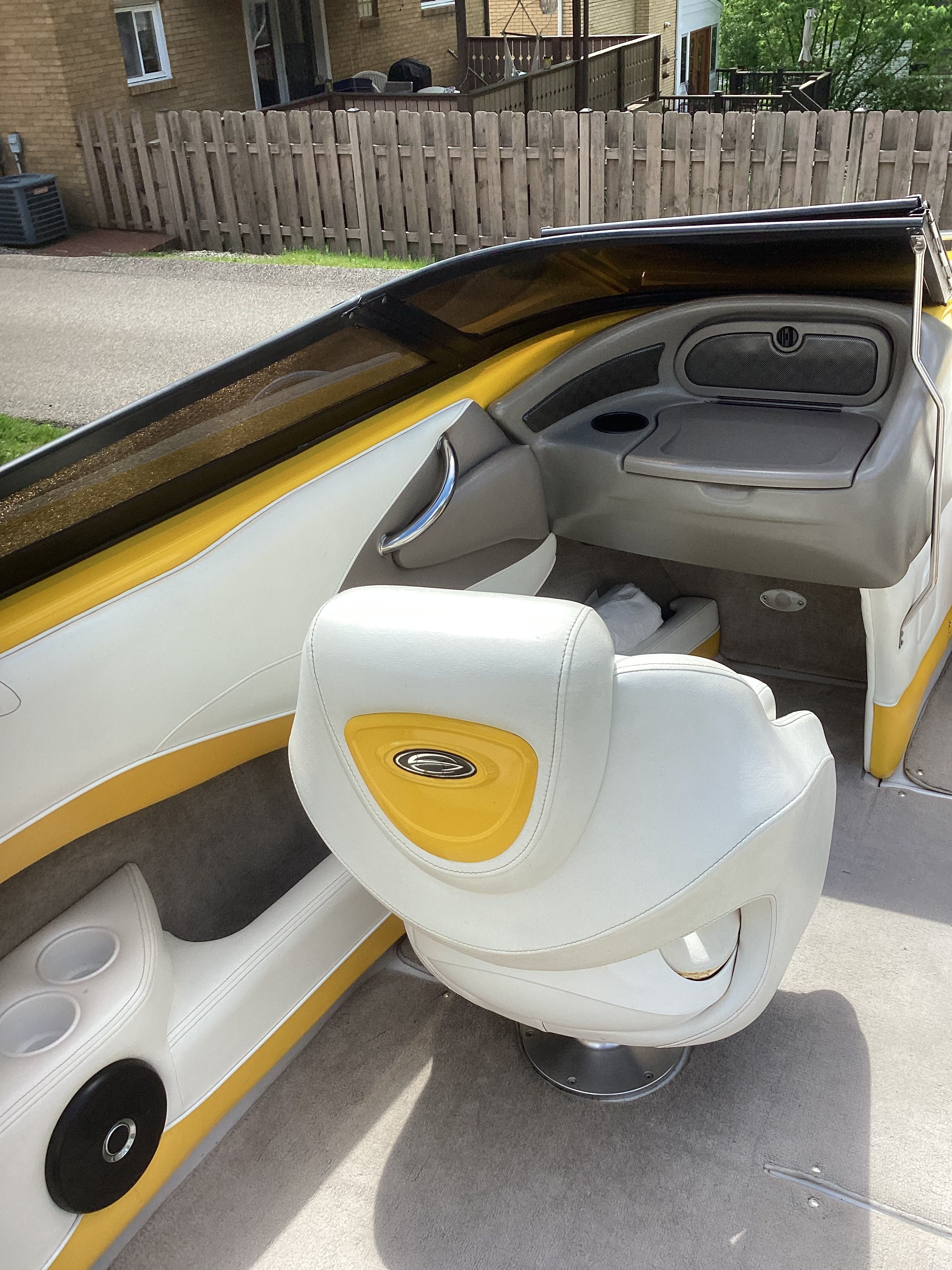 Interior of a 2005 Crownline 202 BR LPX boat with yellow accents.