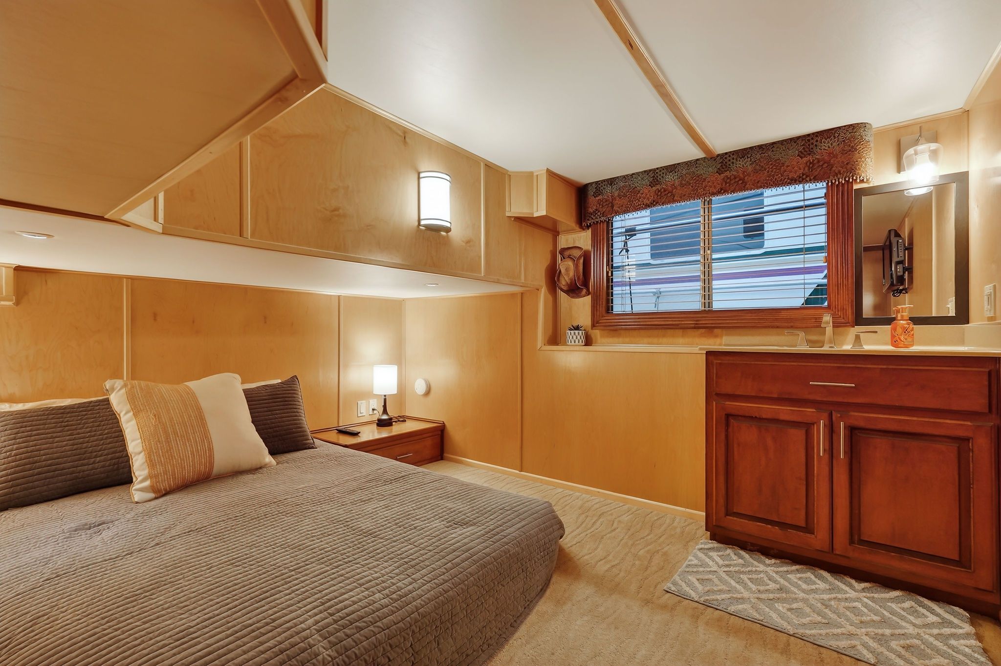 Cozy bedroom on a 2010 Houseboat Throughbred.