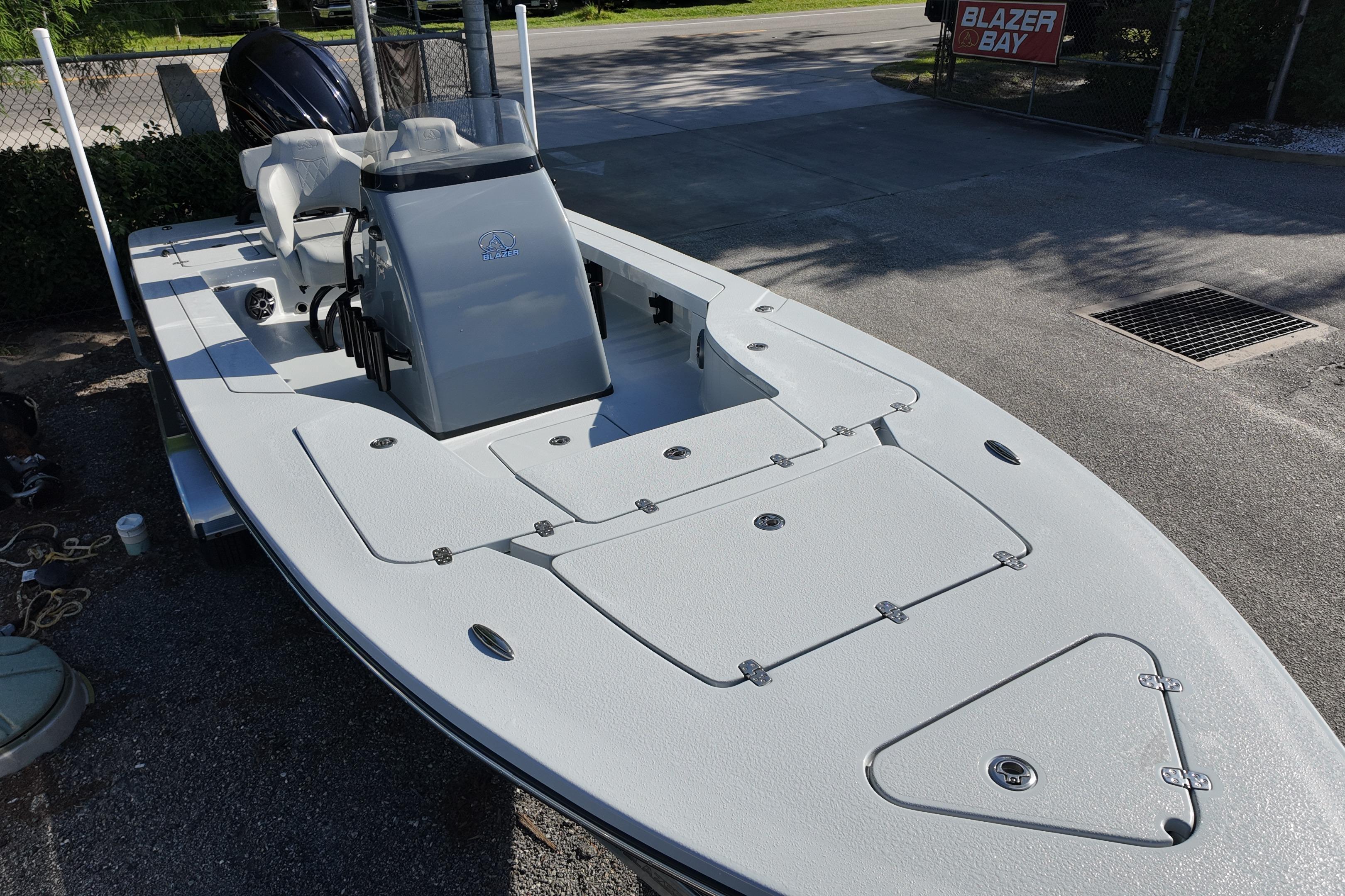 2026 Blazer Bay 675 Ultimate Bay boat, sleek design, parked outdoors.