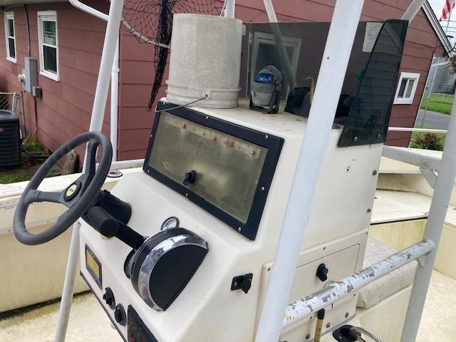 1995 KenCraft Challenger 190 boat console with steering wheel and controls.