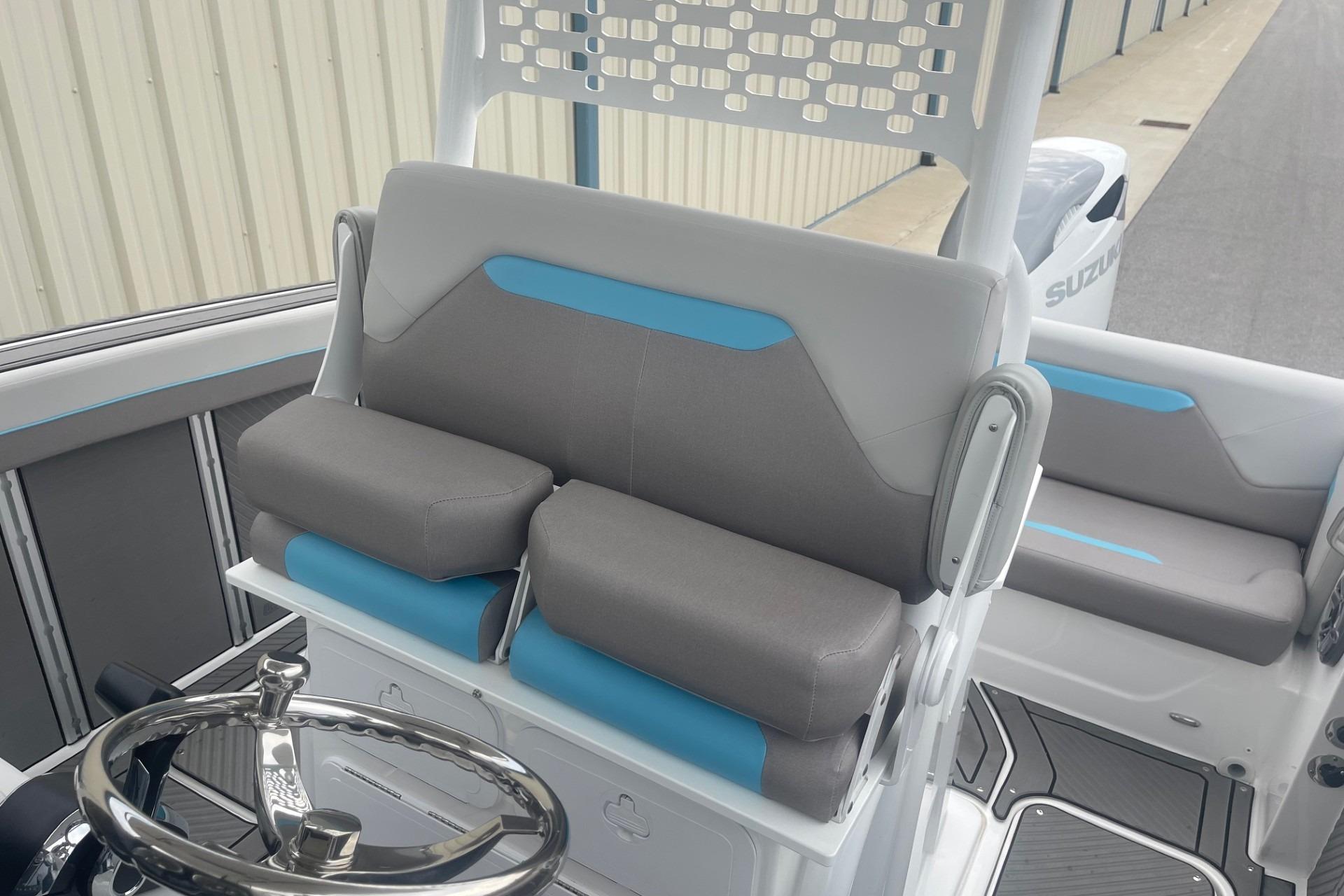 2025 Hurricane Center Console 24 OB boat interior with gray and blue seating.