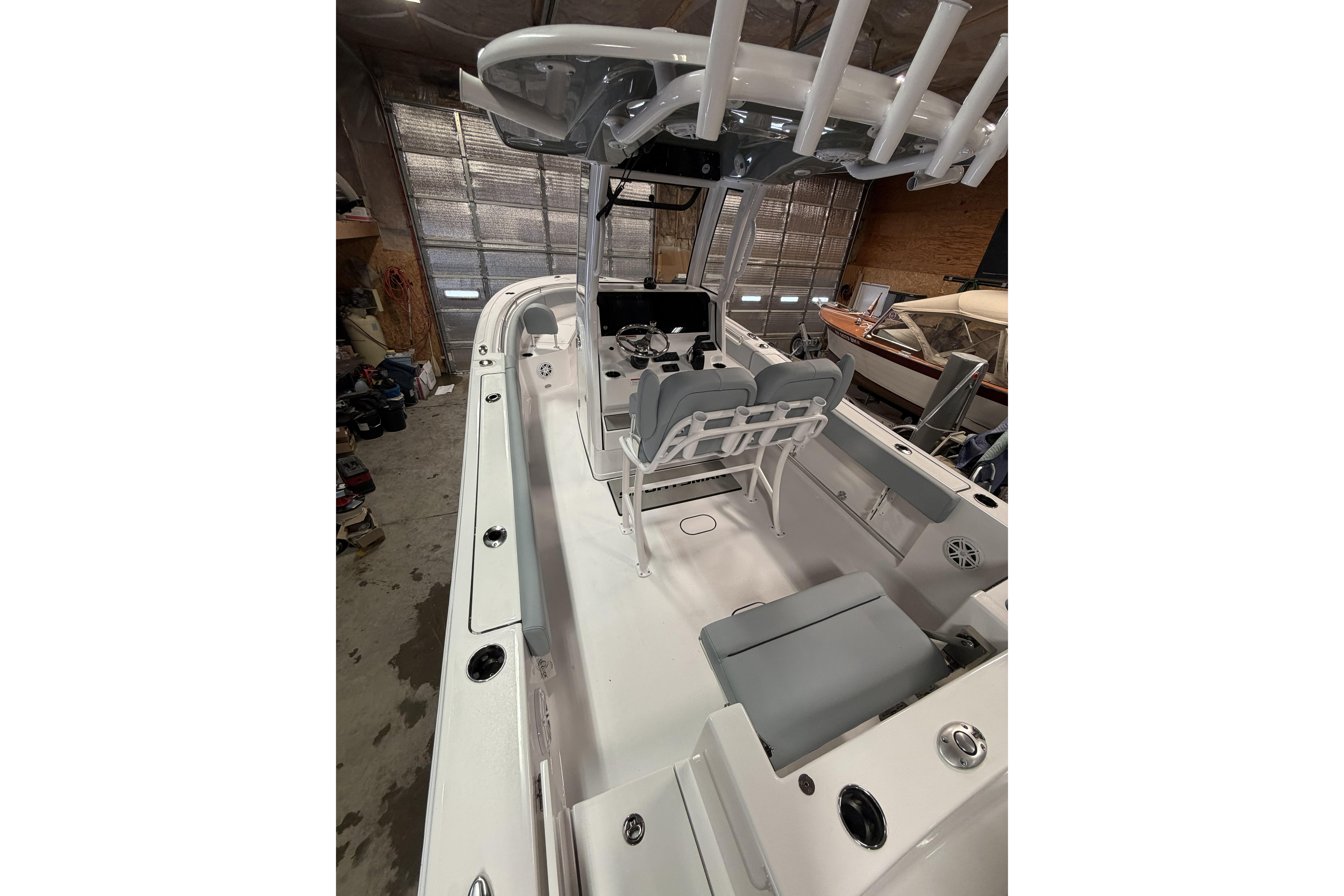 2026 Sportsman Open 232 Center Console boat interior with seating and helm station.