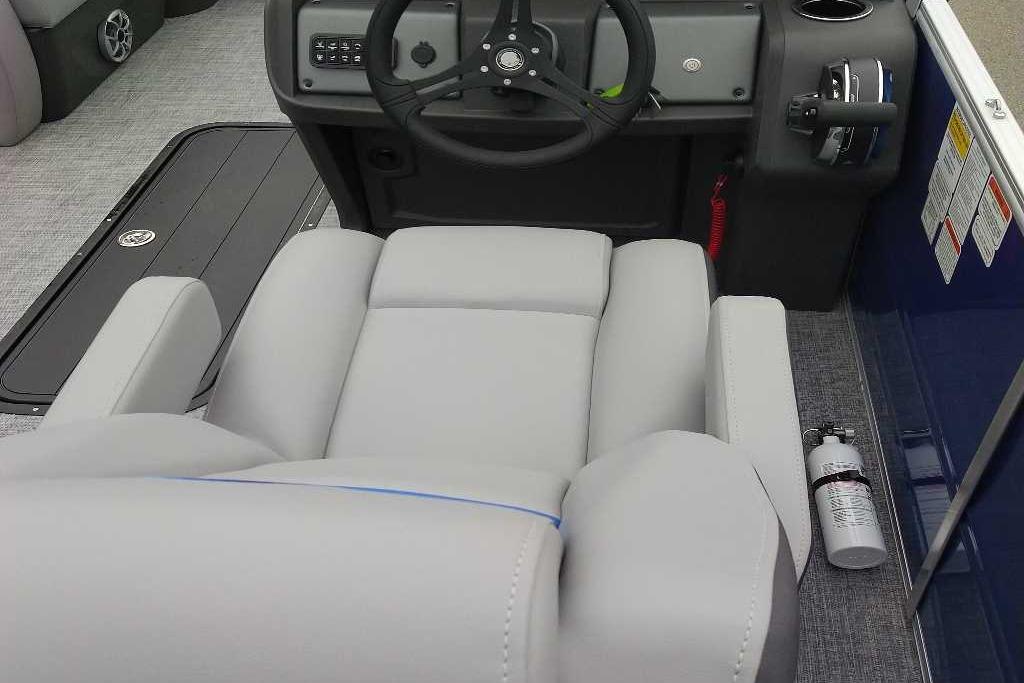 Interior of 2026 Sun Tracker Party Barge 22 RF XP3 with steering console and seating.