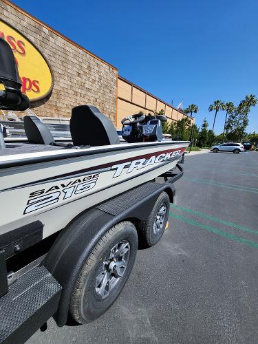 2025 Tracker Savage 215 boat parked outdoors on a sunny day.