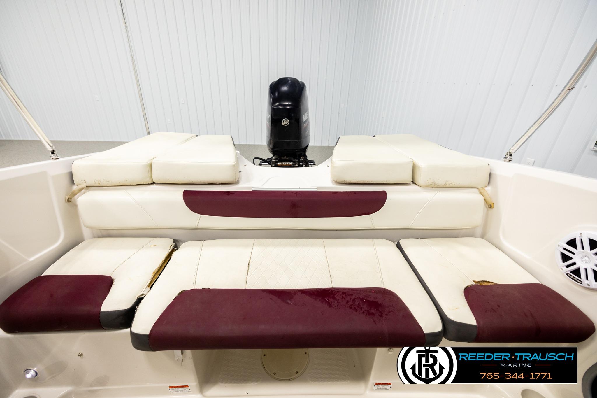 2016 Tahoe 450 TS boat interior with cushioned seating and motor, Reeder-Trausch Marine branding.