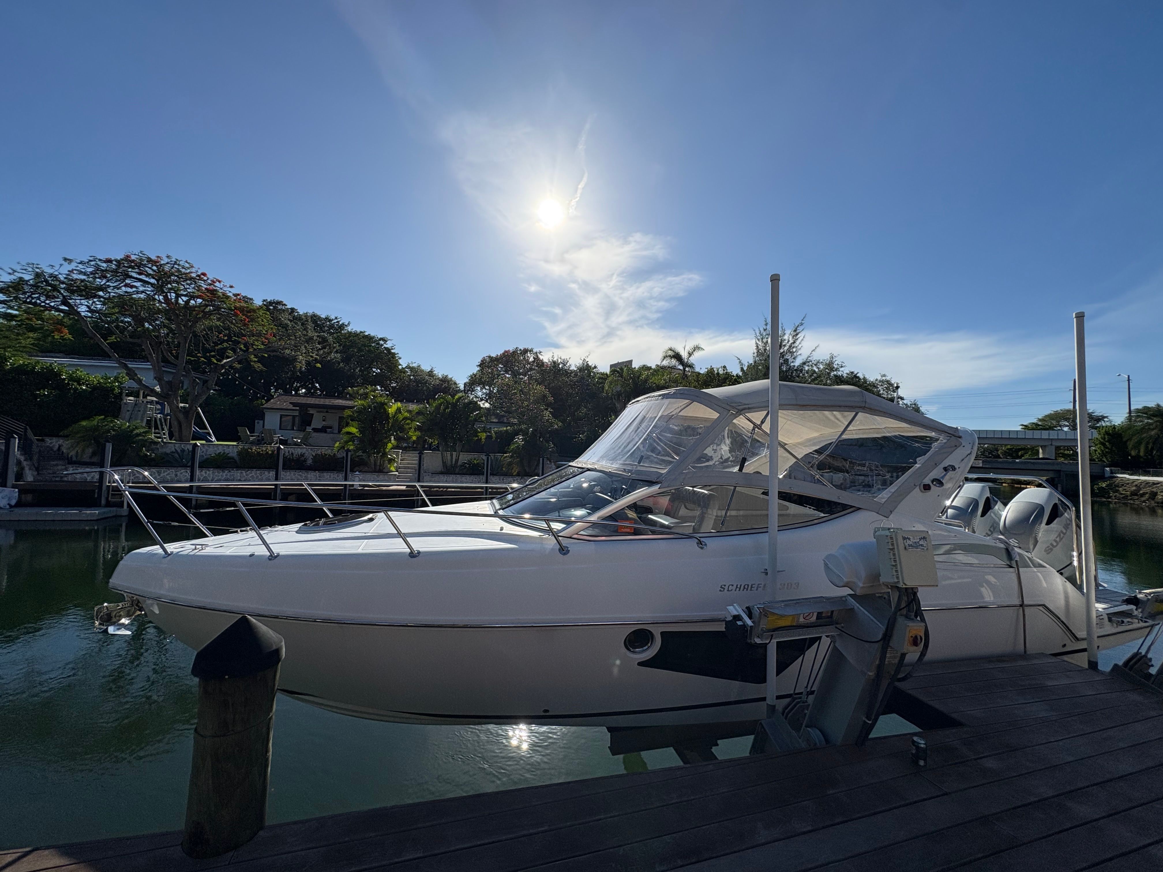 Schaefer 303 Sport 2023 at a dock on a sunny day.