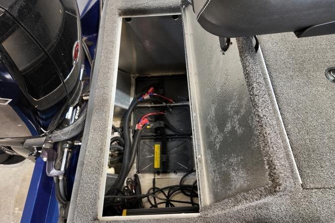 2024 Lowe Stinger 198 boat battery compartment with wiring and motor components.