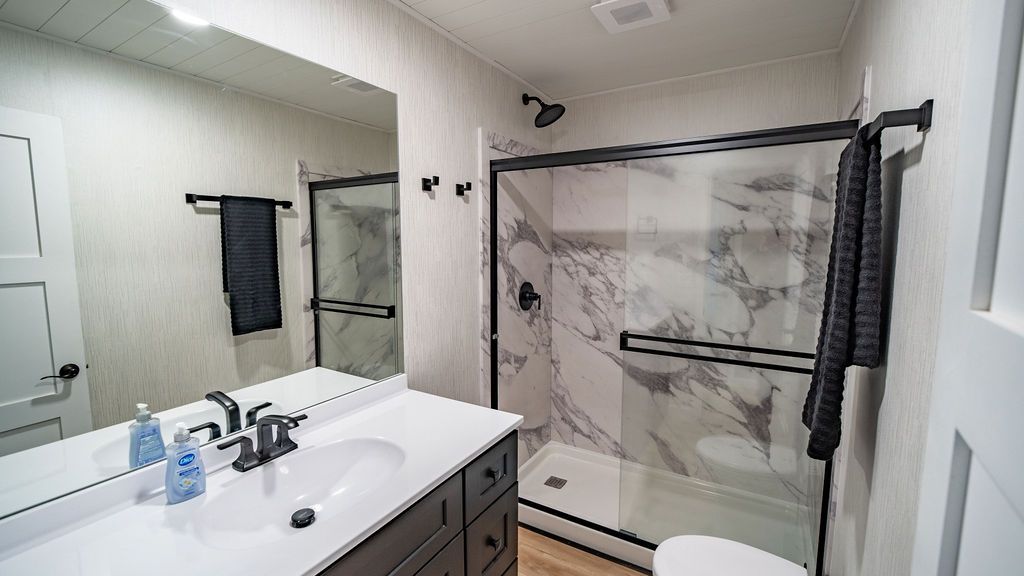 Modern bathroom with marble shower in 1999 Sumerset Widebody.
