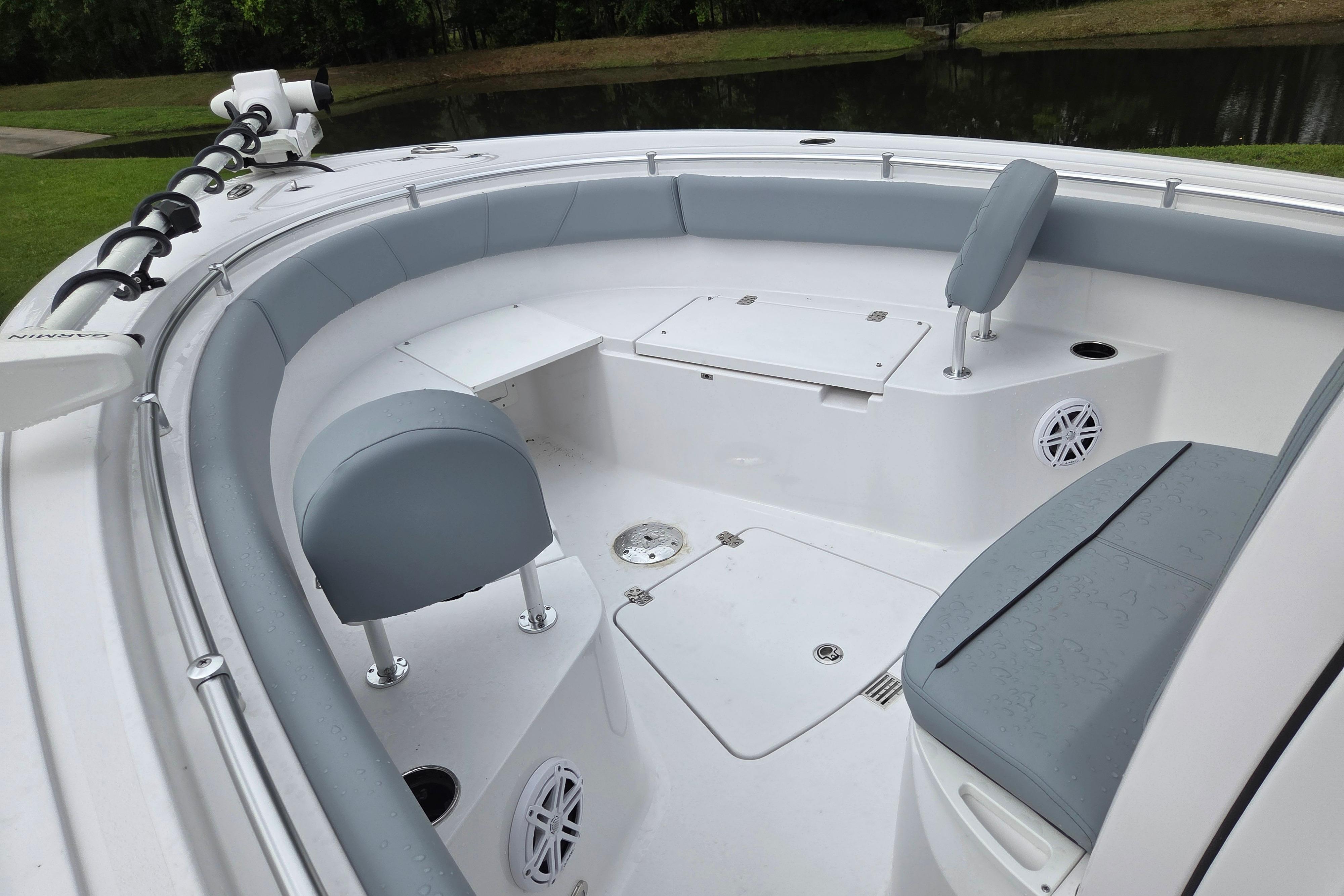 2026 Sportsman Open 232 Center Console boat interior with seating and storage compartments.