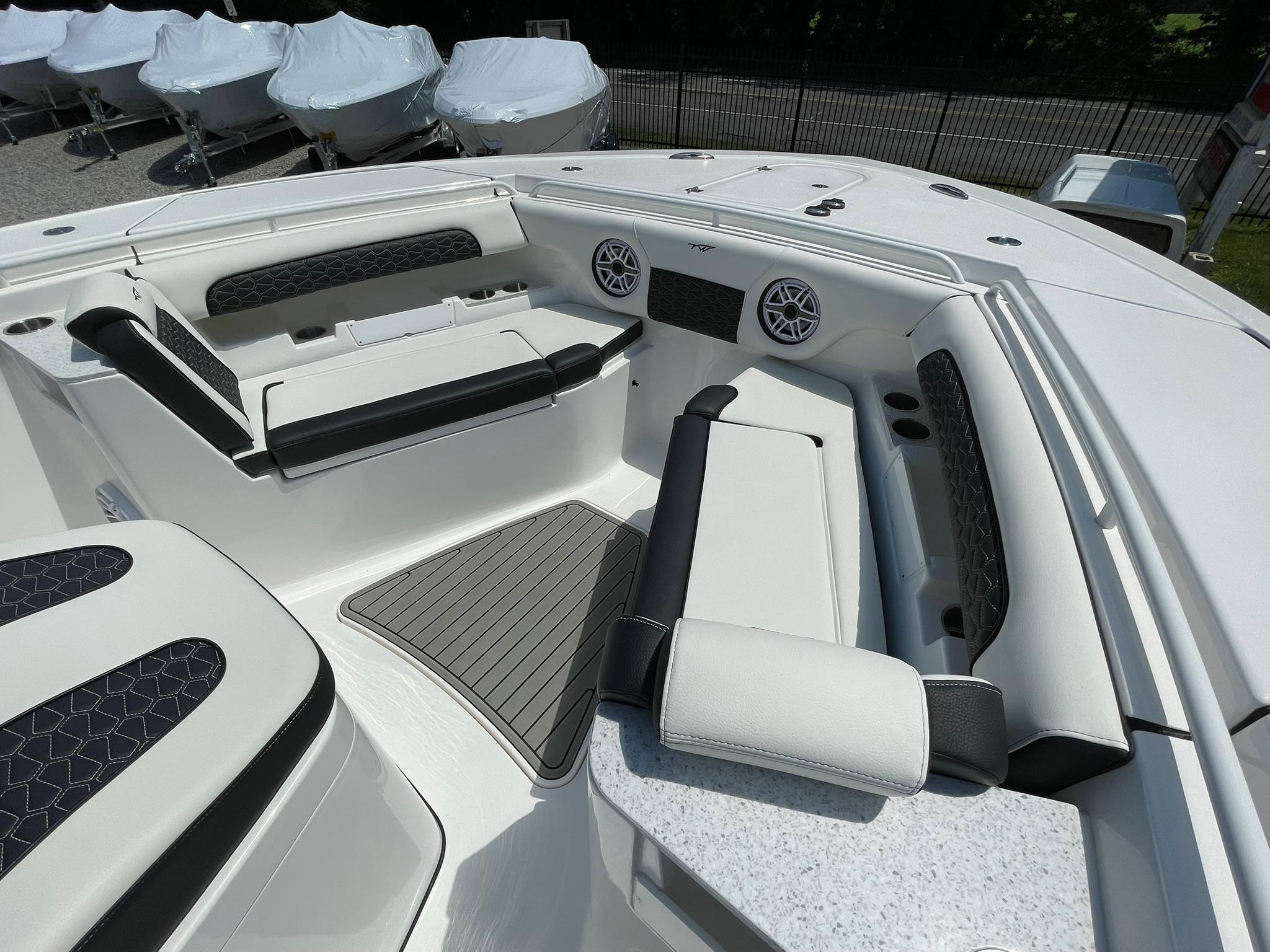 2026 Tidewater 302 CC Adventure boat interior with cushioned seating and modern design.
