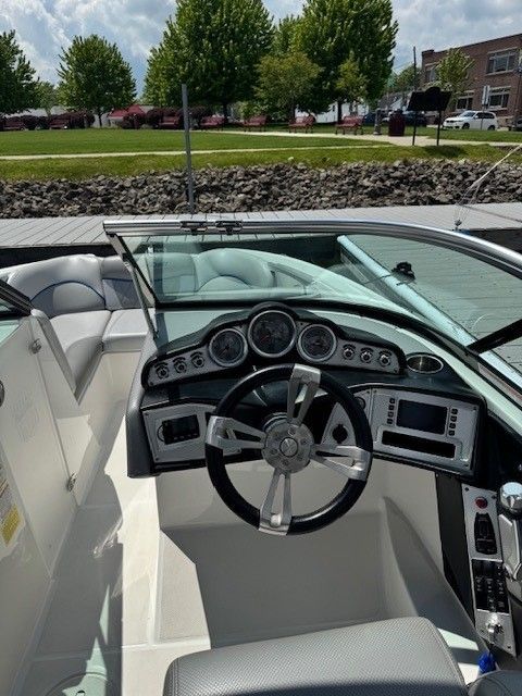 Interior view of a 2015 MasterCraft X-2 boat with steering console.