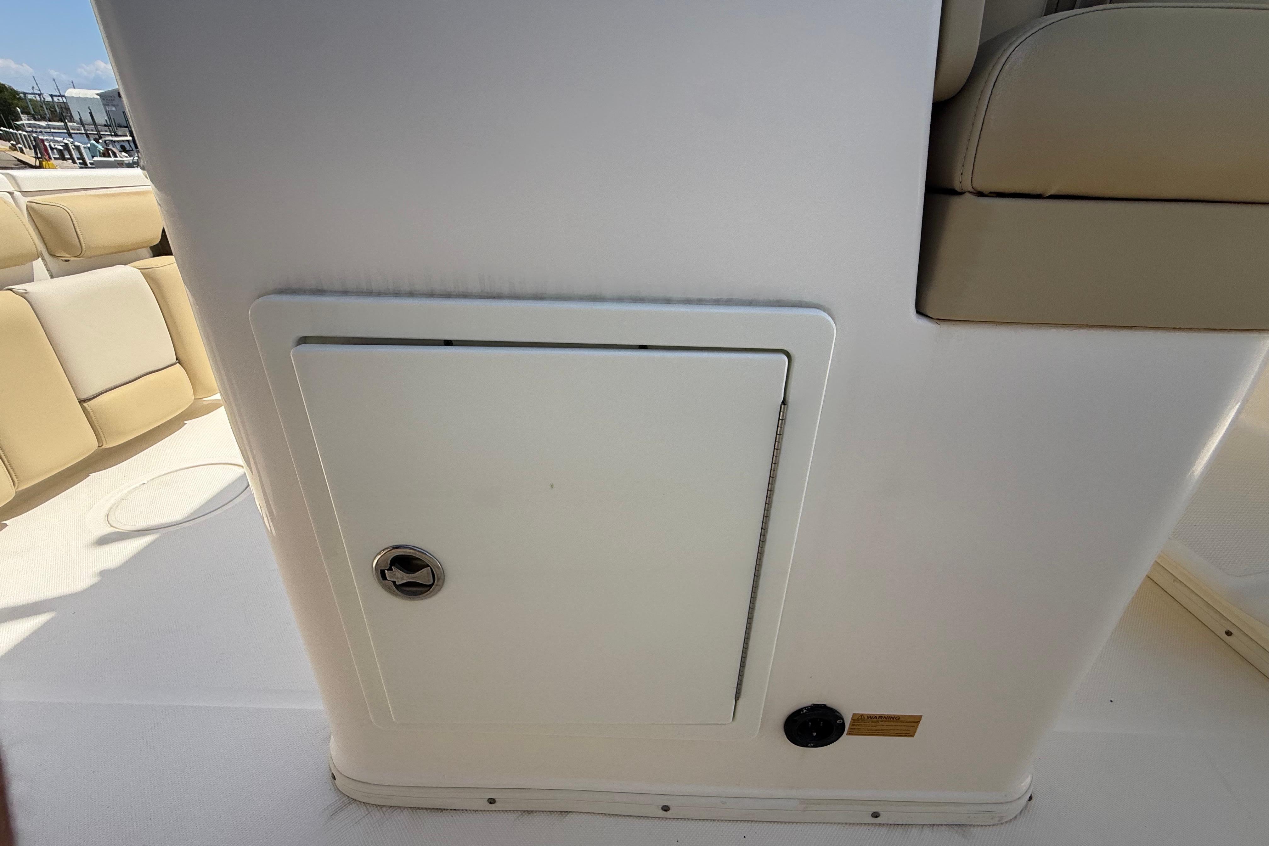 2019 Key West Billistic 281 Center Console interior with storage compartment.