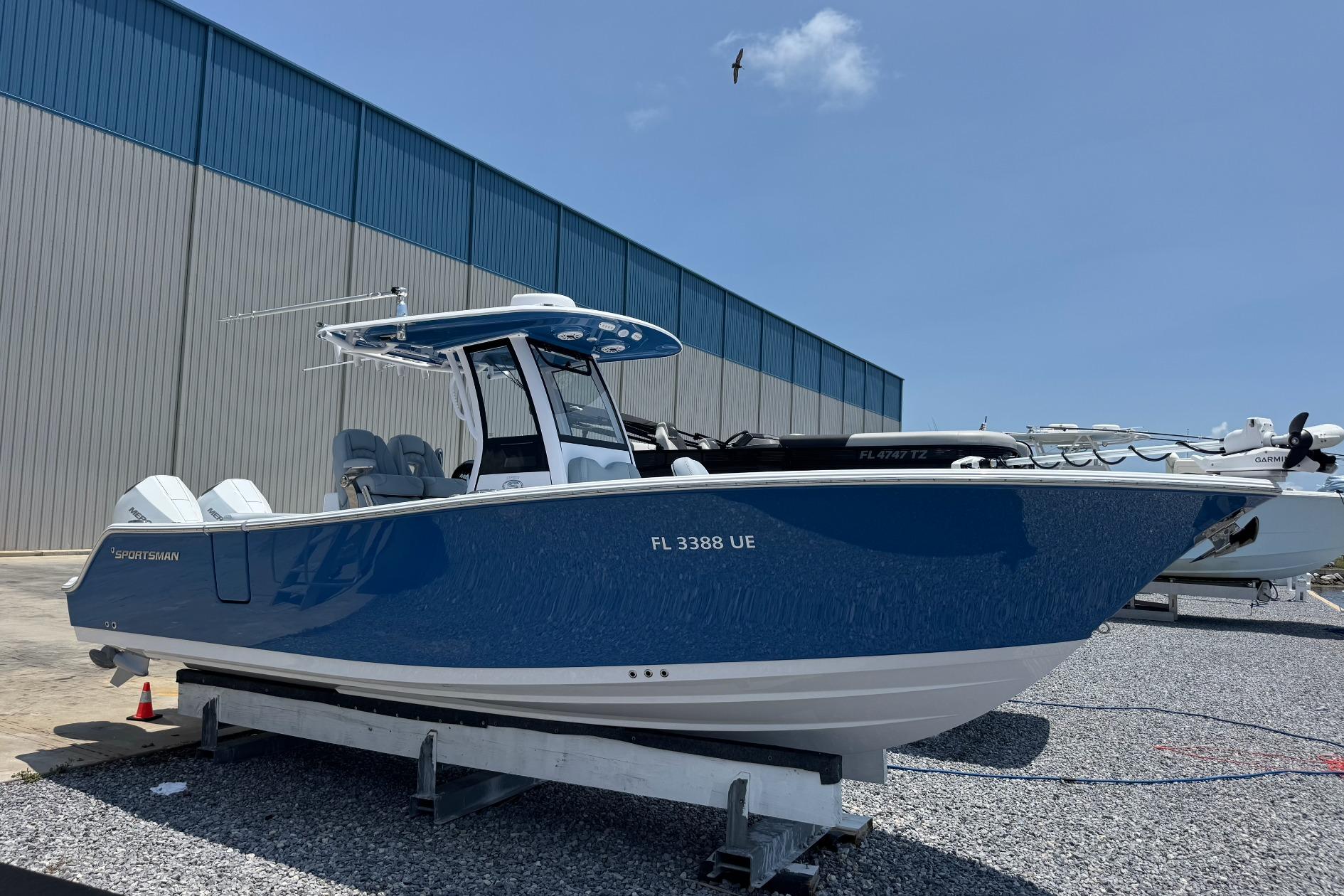 2026 Sportsman Open 262 Center Console boat on display outdoors.