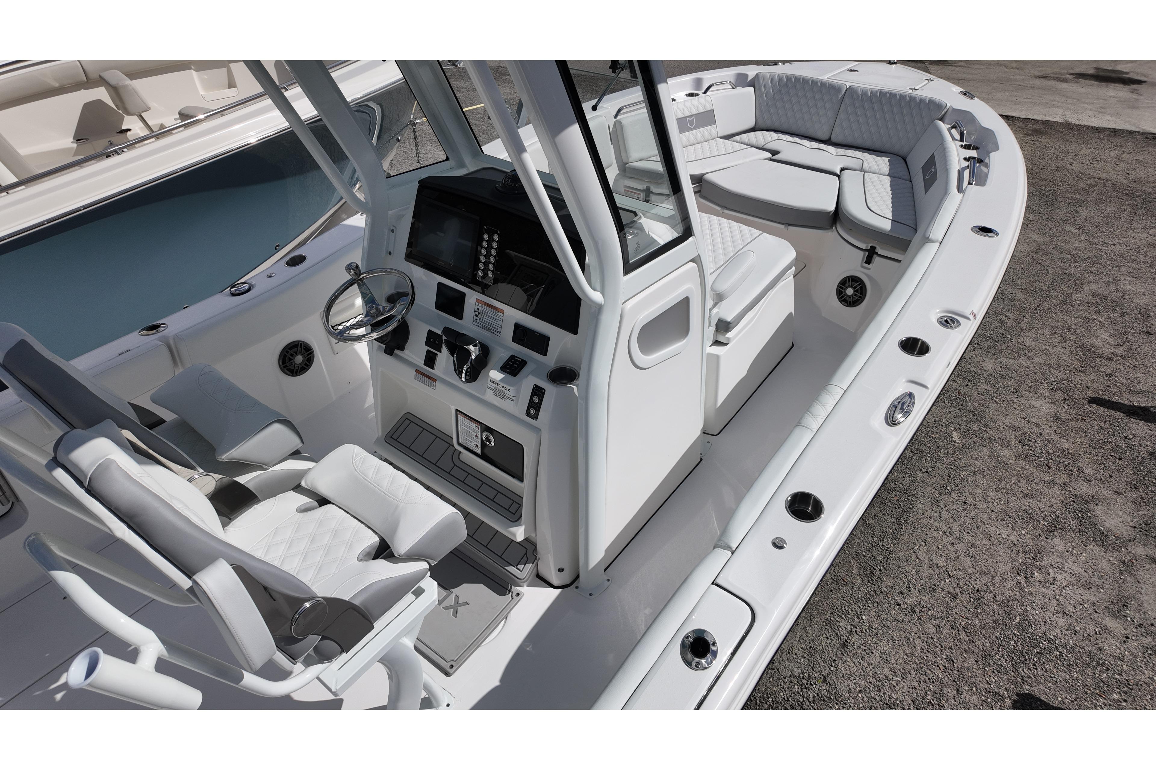 2026 Sea Fox 268 Commander boat interior with helm, seating, and modern controls.