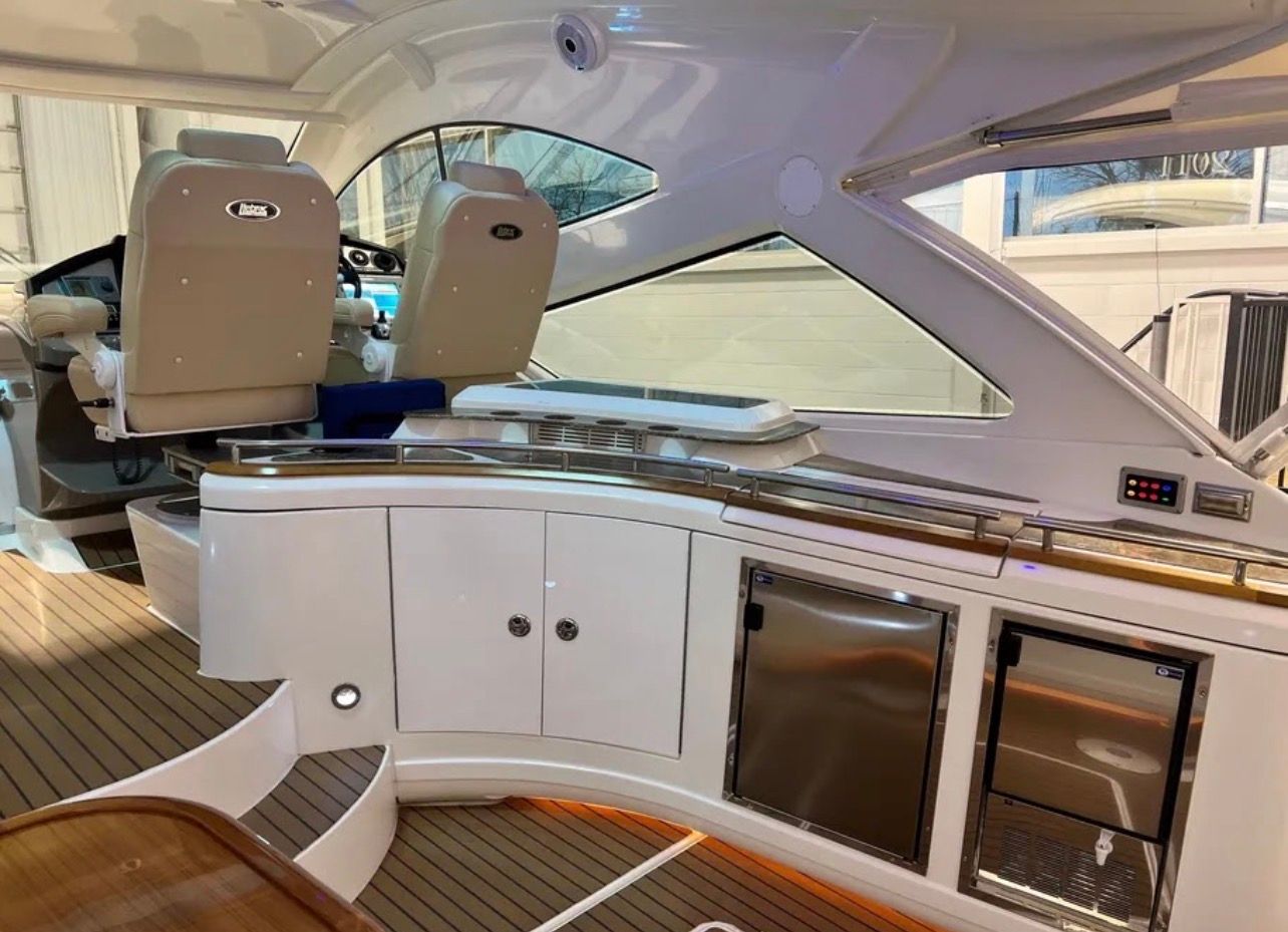 Interior of a 2009 Cruisers Yachts 520 Sports Coupe with sleek design and wooden flooring.
