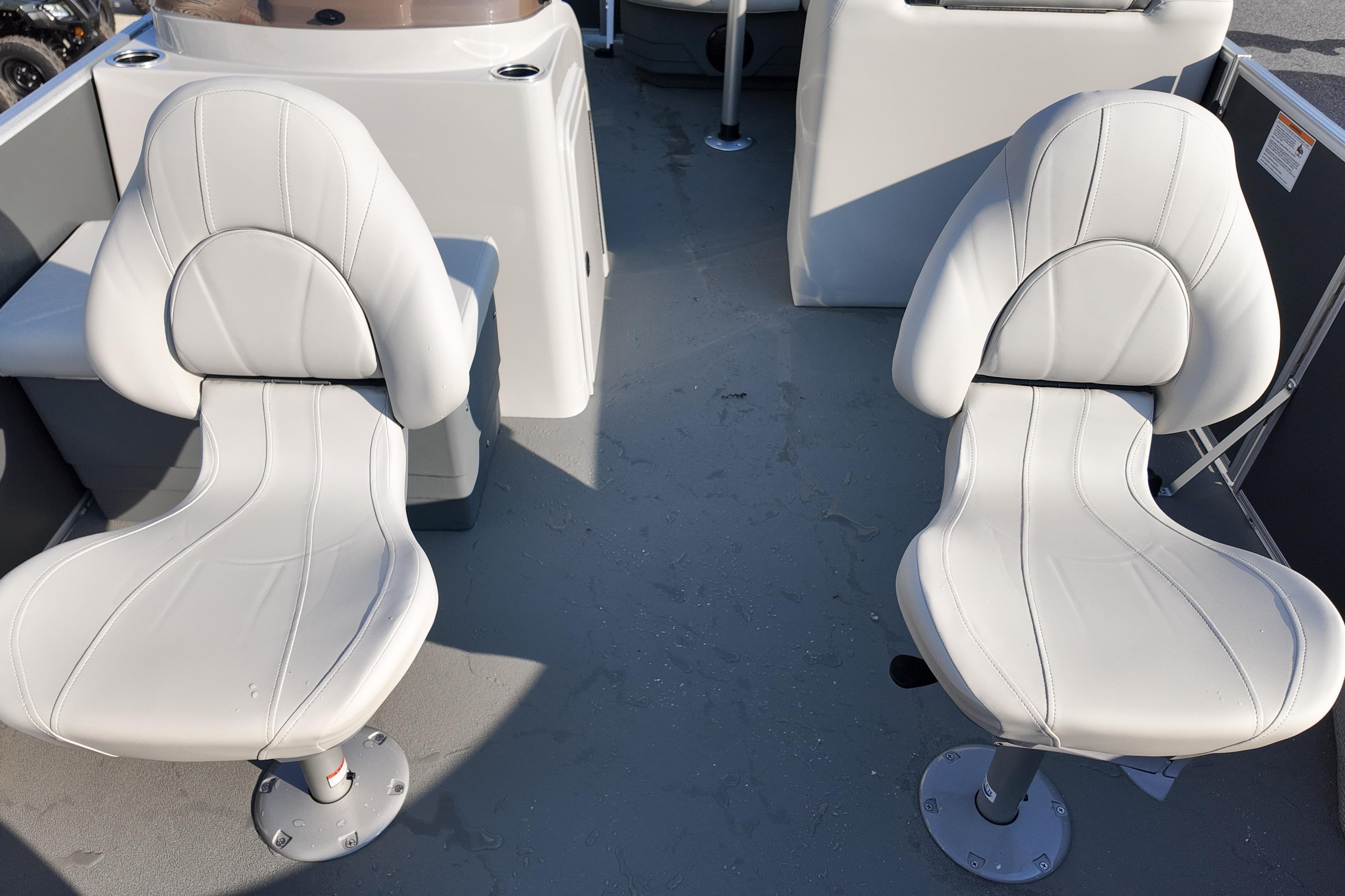 2026 Sylvan Mirage 818 Fish boat interior with two white swivel seats.