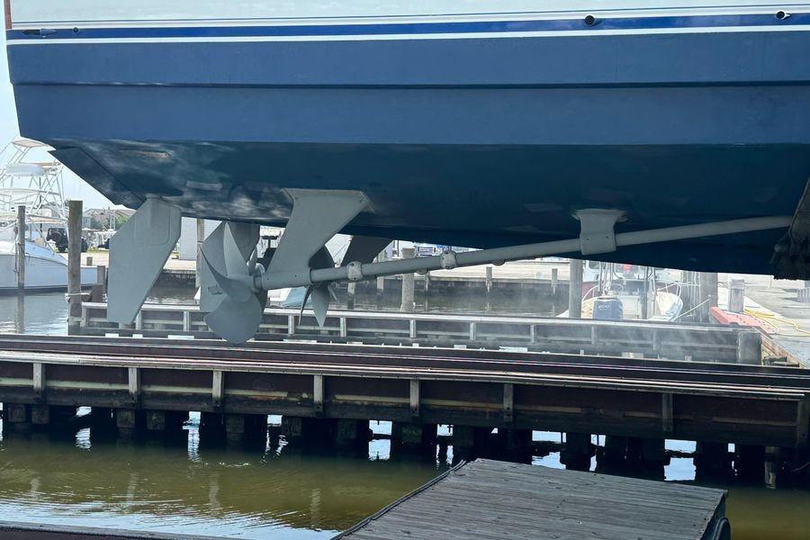 2002 Viking 61 Enclosed Bridge yacht hull and propellers at dockside.