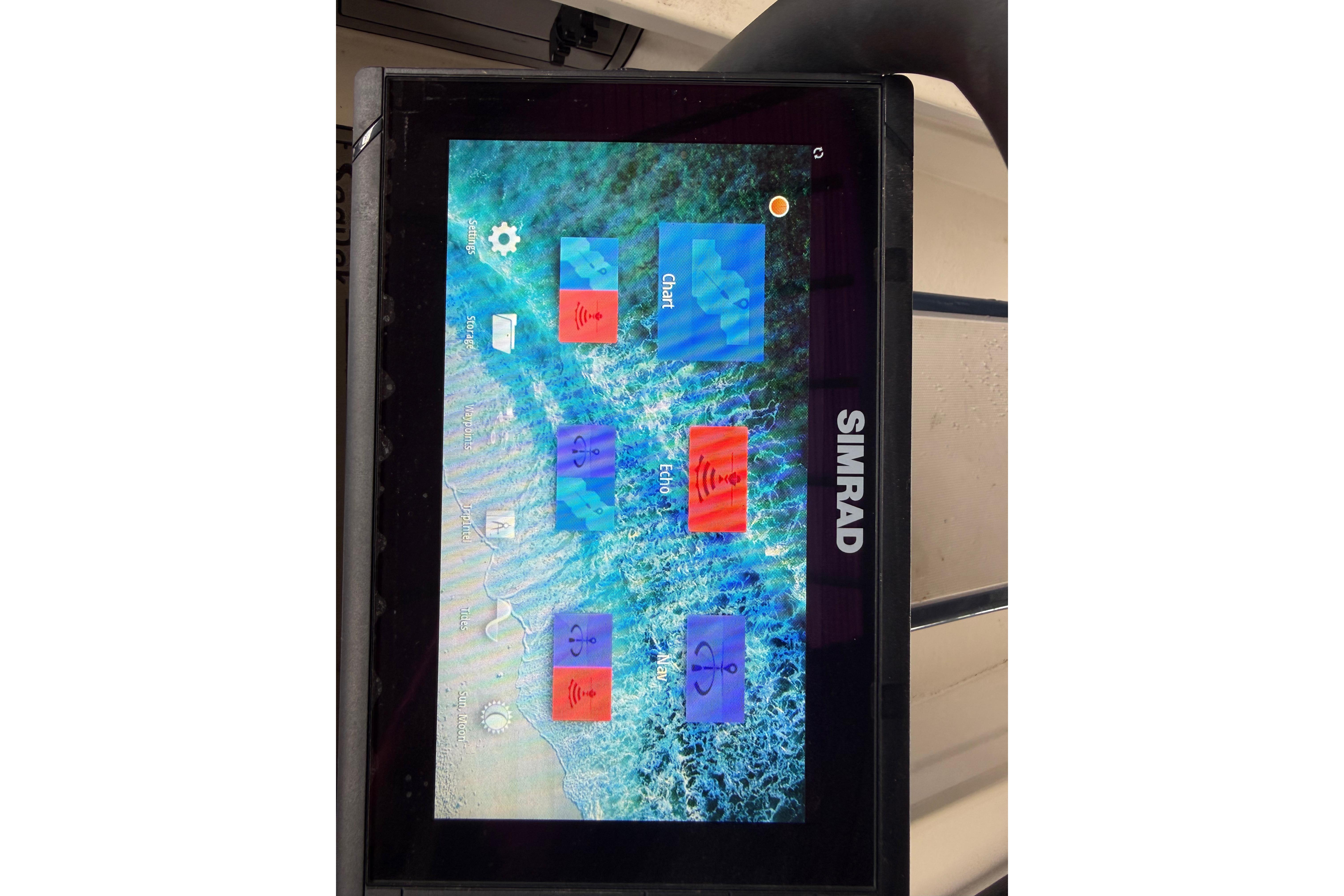 Simrad marine display on a 2020 Skimmer Skiff 14, showing navigation and sonar options.