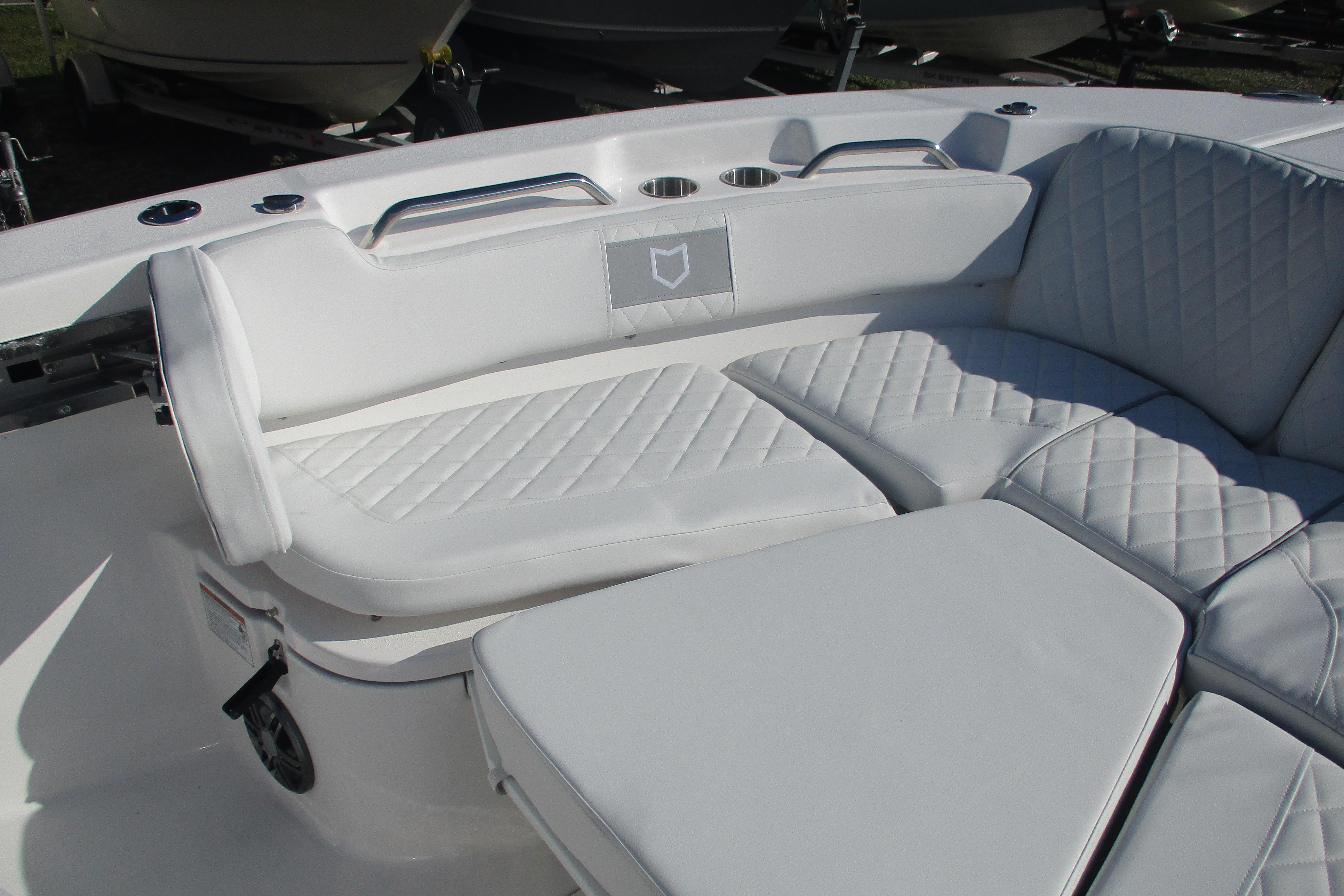 Luxurious seating on 2026 Sea Fox 268 Commander boat with quilted white upholstery.