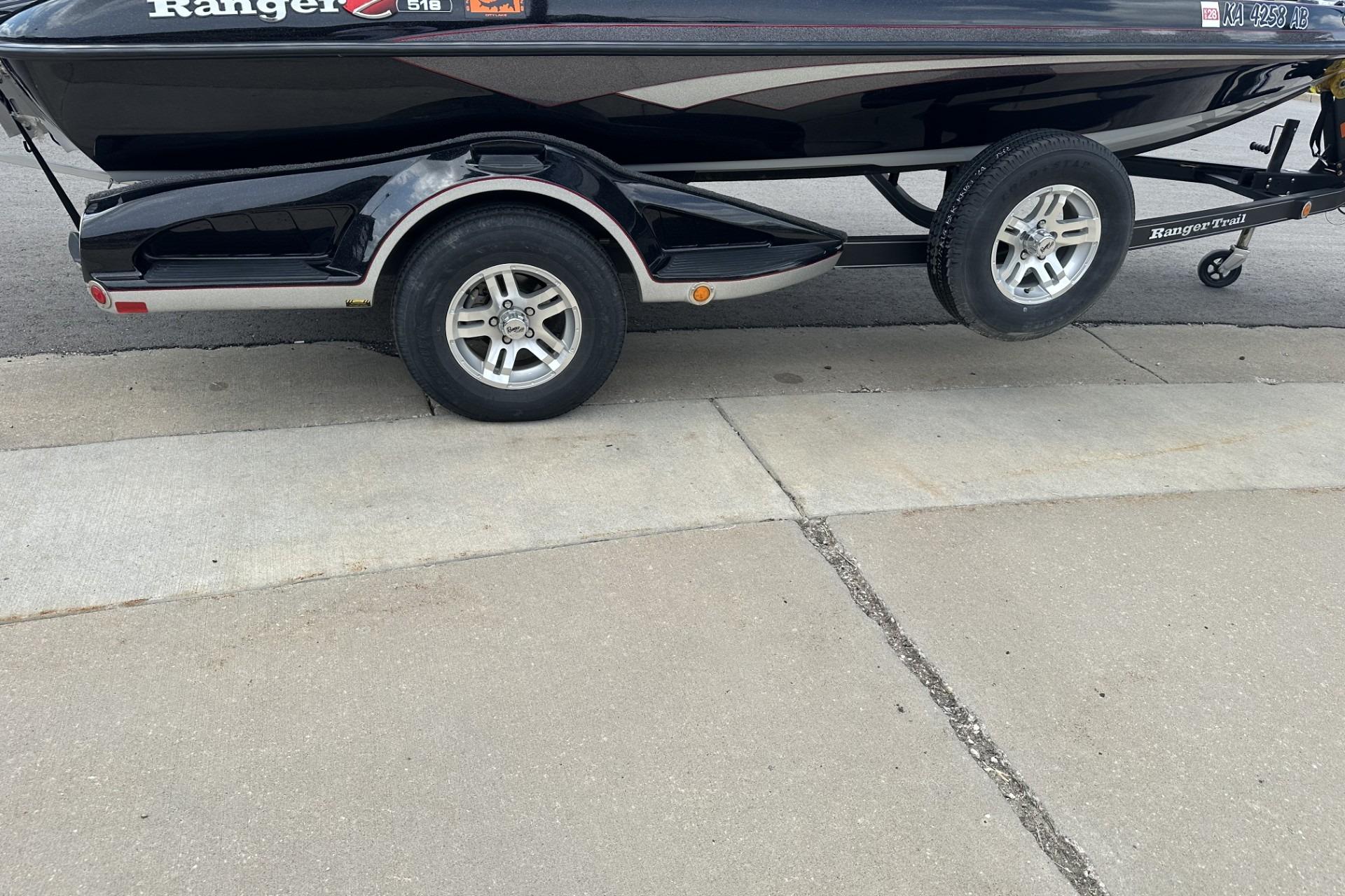 2018 Ranger Z518 boat on trailer, parked on concrete surface.