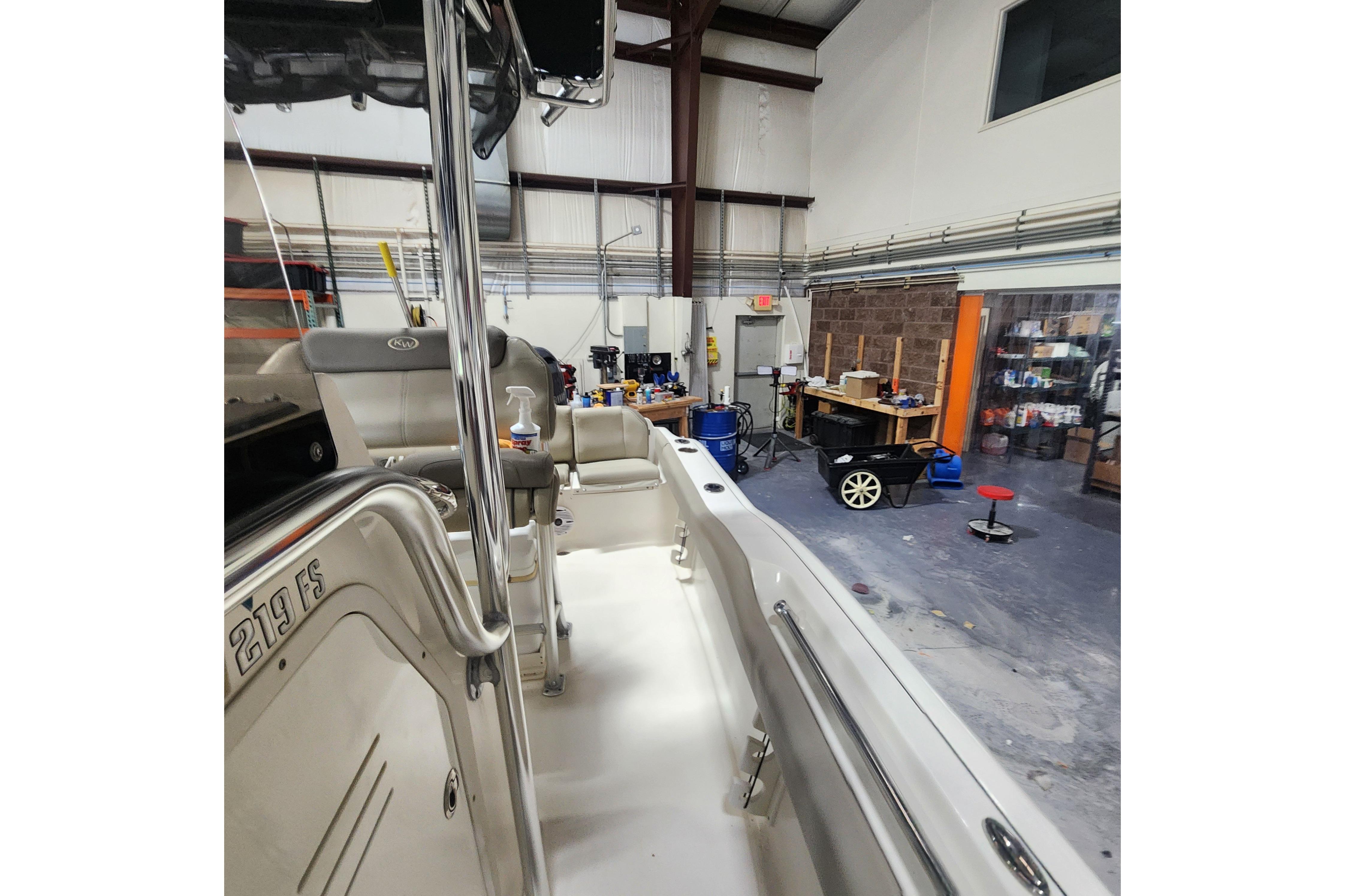 2023 Key West 219 FS boat interior in a workshop setting.