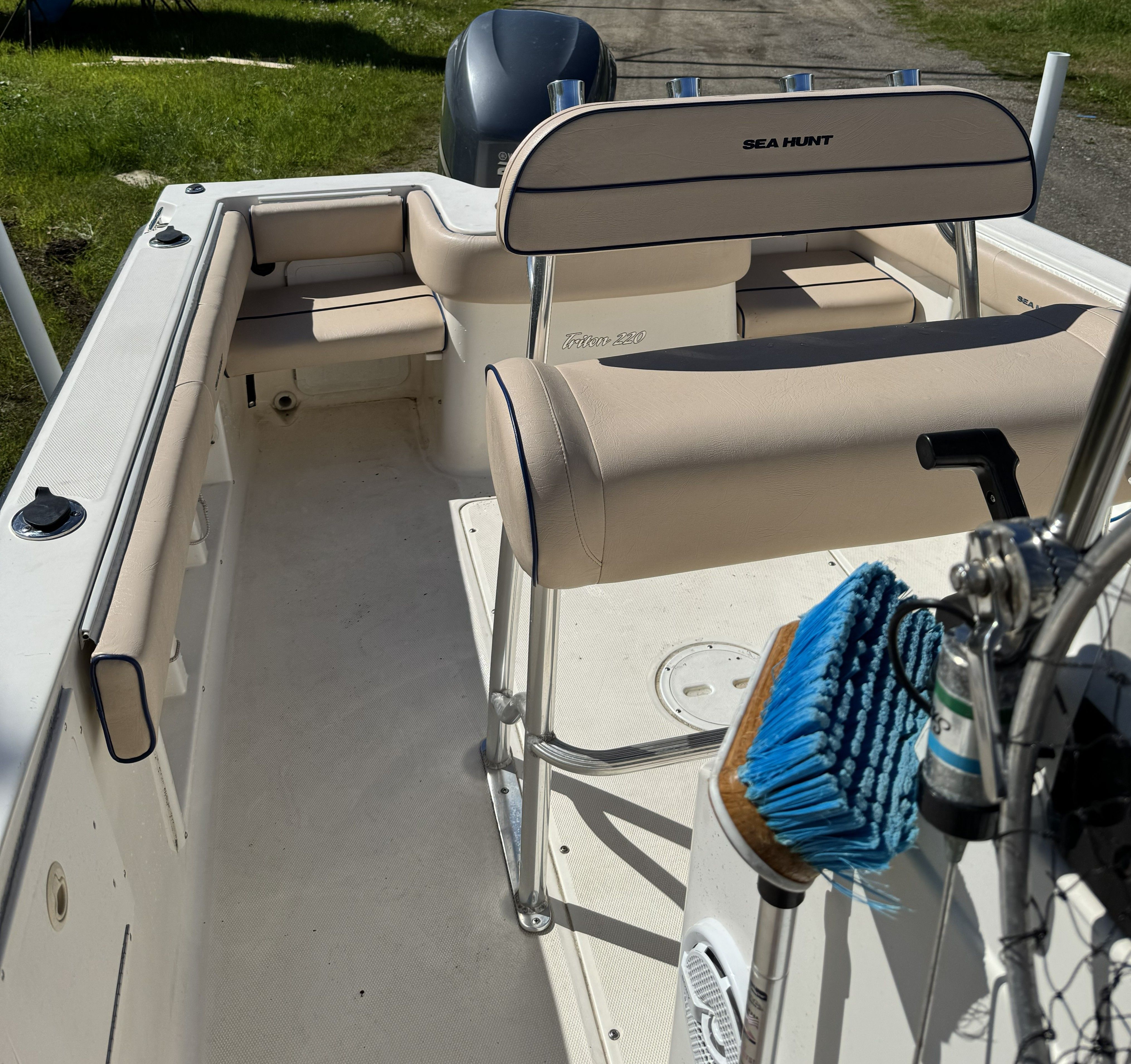 Interior view of a 2004 Sea Hunt Triton boat with seating area.