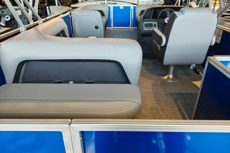 2026 Sun Tracker Party Barge 18 DLX interior with seating and steering console.