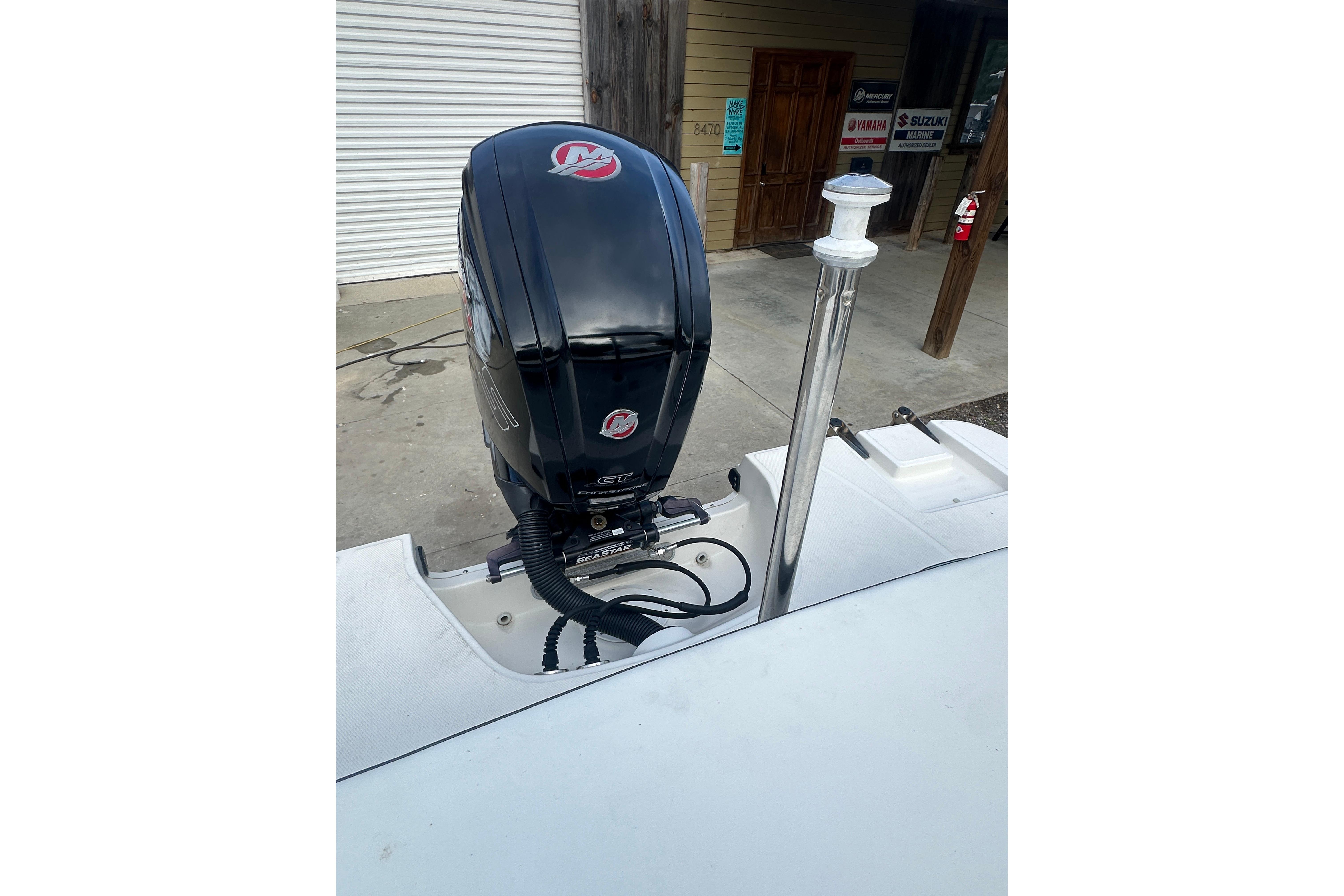 2017 Sea Ray SPX 190 Outboard motor, docked, with visible engine and surroundings.