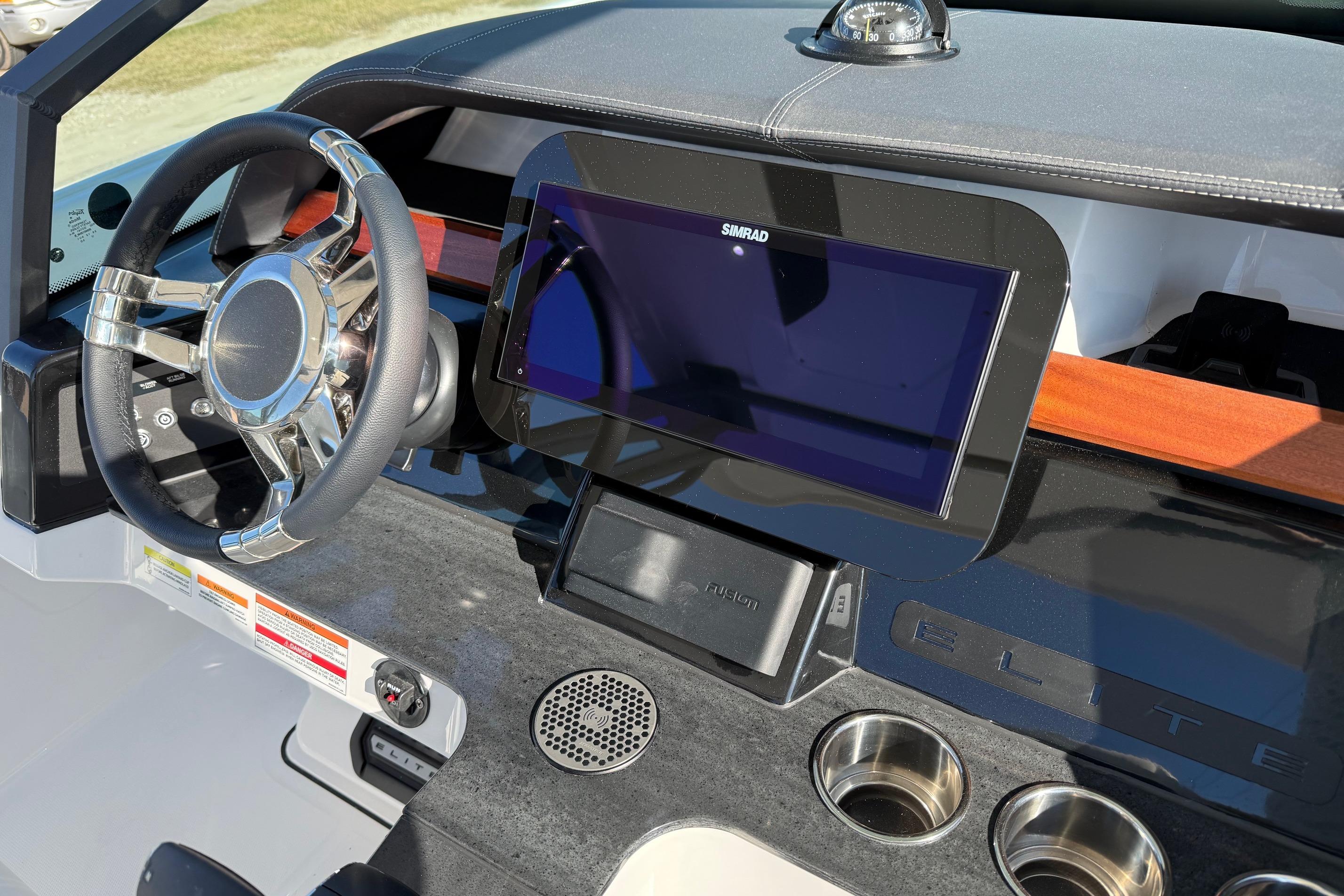 Dashboard of 2026 Monterey Elite 27 OB with Simrad display.