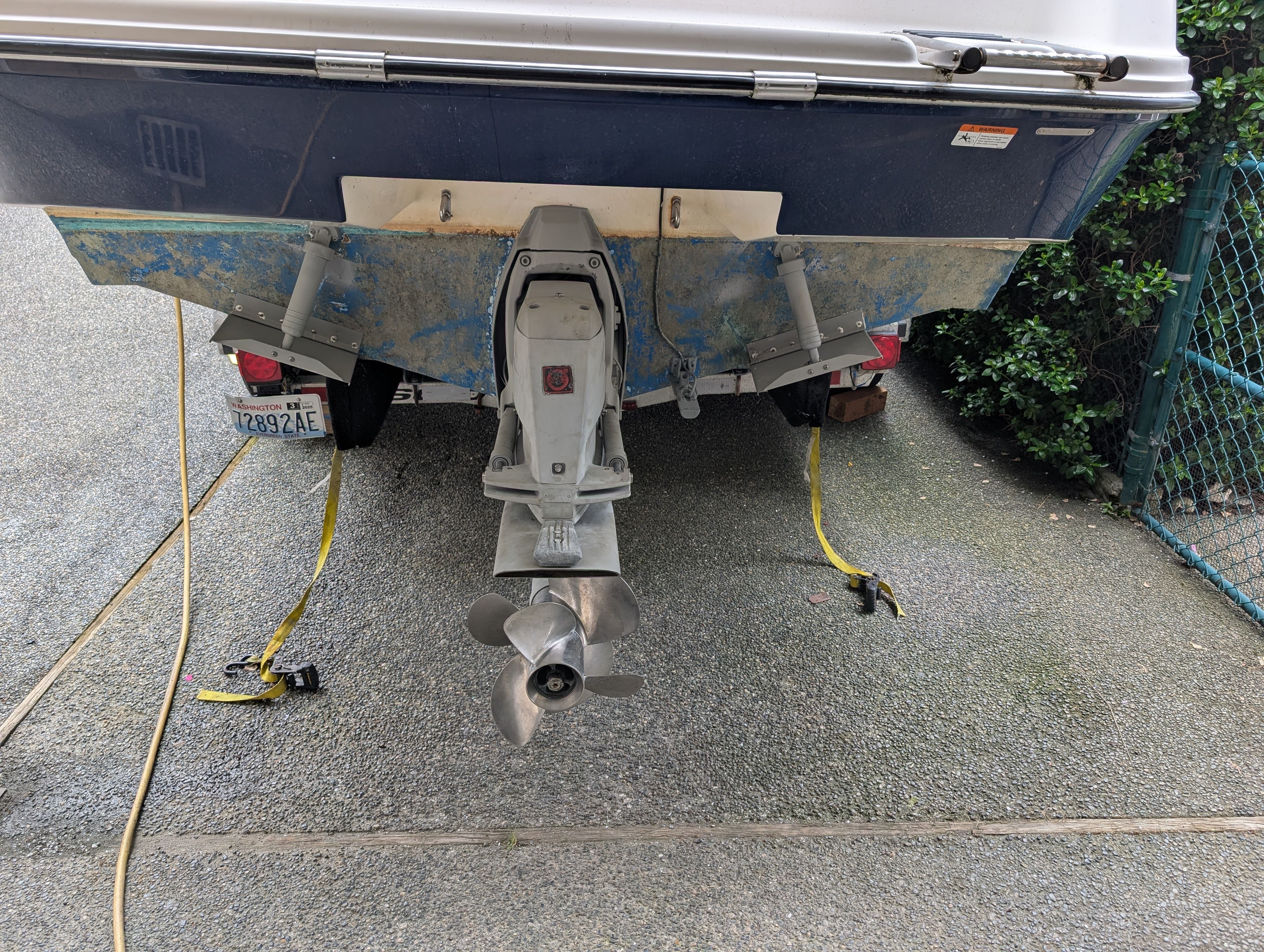 Rear view of a 2006 Glastron GS boat on a trailer.