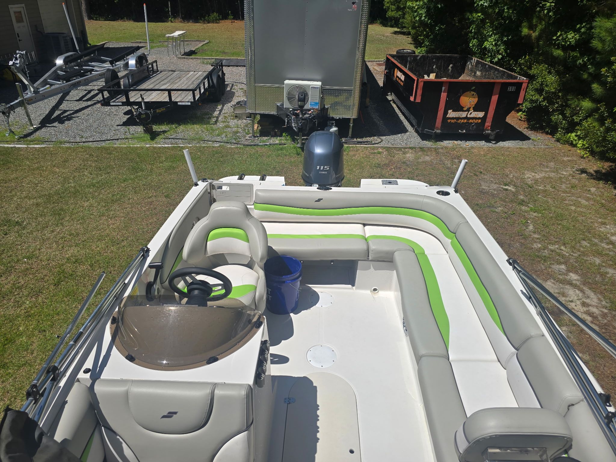 The image shows a 2017 Starcraft MDX 191 OB boat with green and white upholstery.