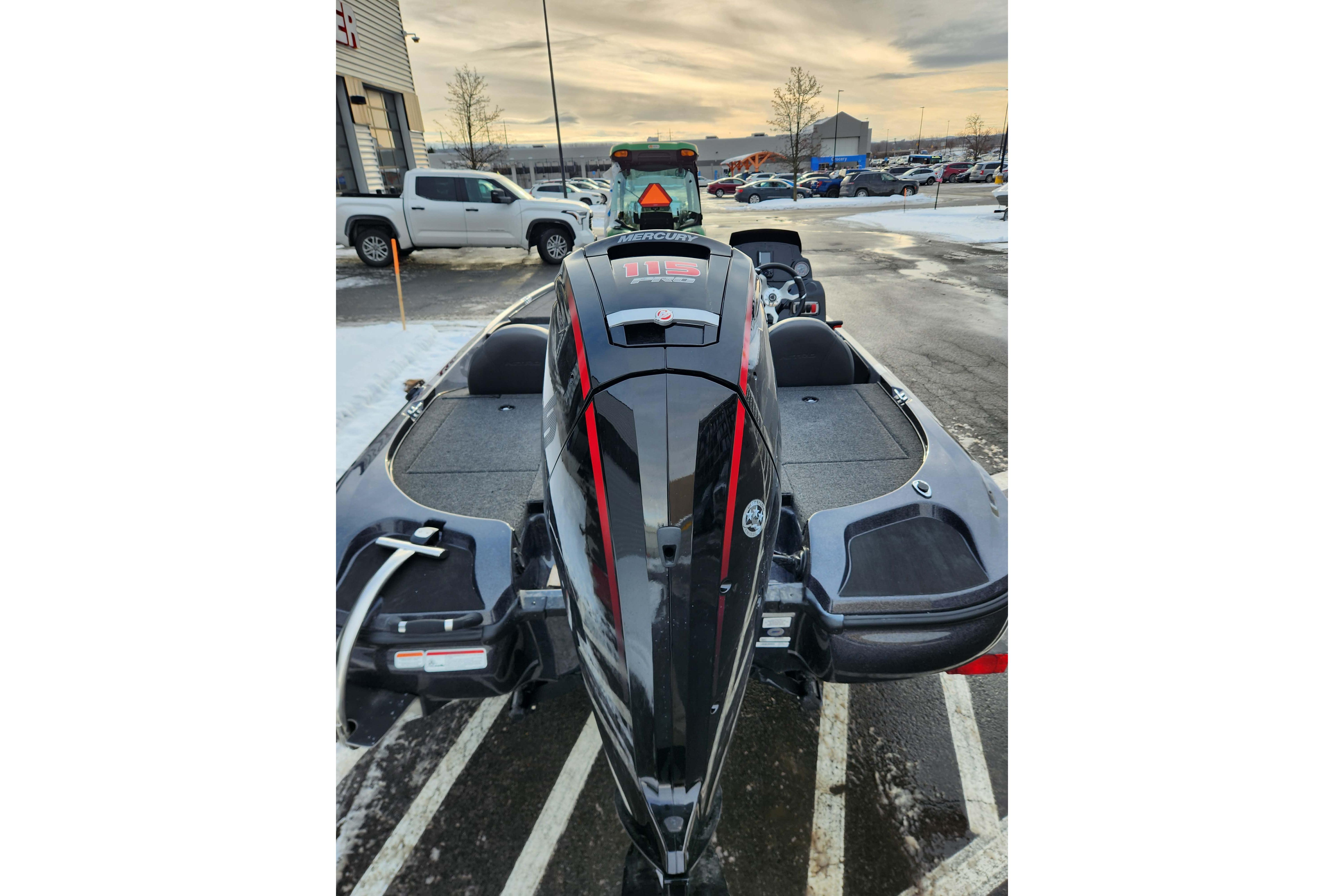 2026 Nitro Z17 boat in parking lot, snowy surroundings, rear view.