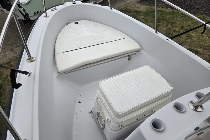 1996 Boston Whaler Outrage 17 boat interior with seating and storage.