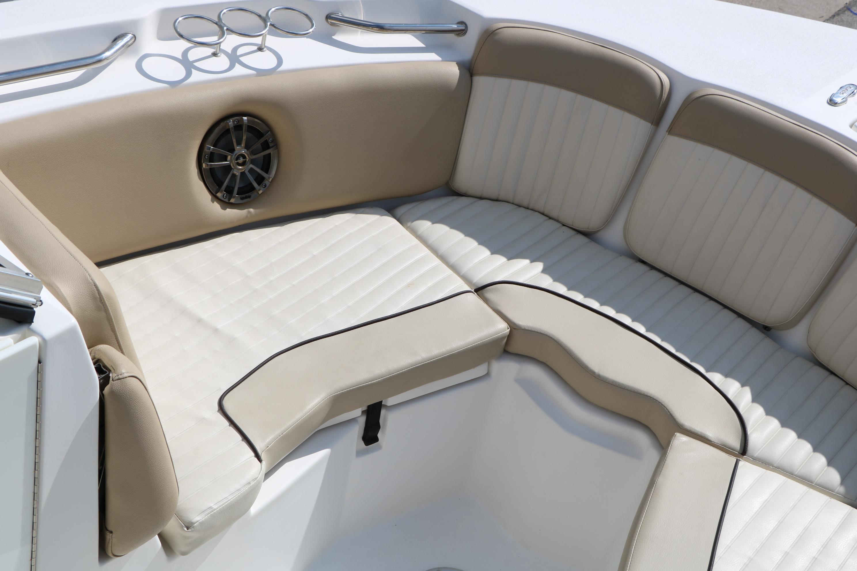 2017 Sea Fox 226 Traveler boat interior with beige cushioned seating and speaker.