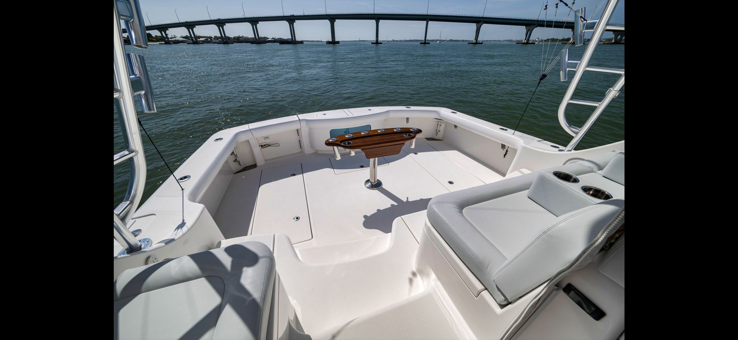 Mag Bay 42 Express 2022 on water with bridge in background.