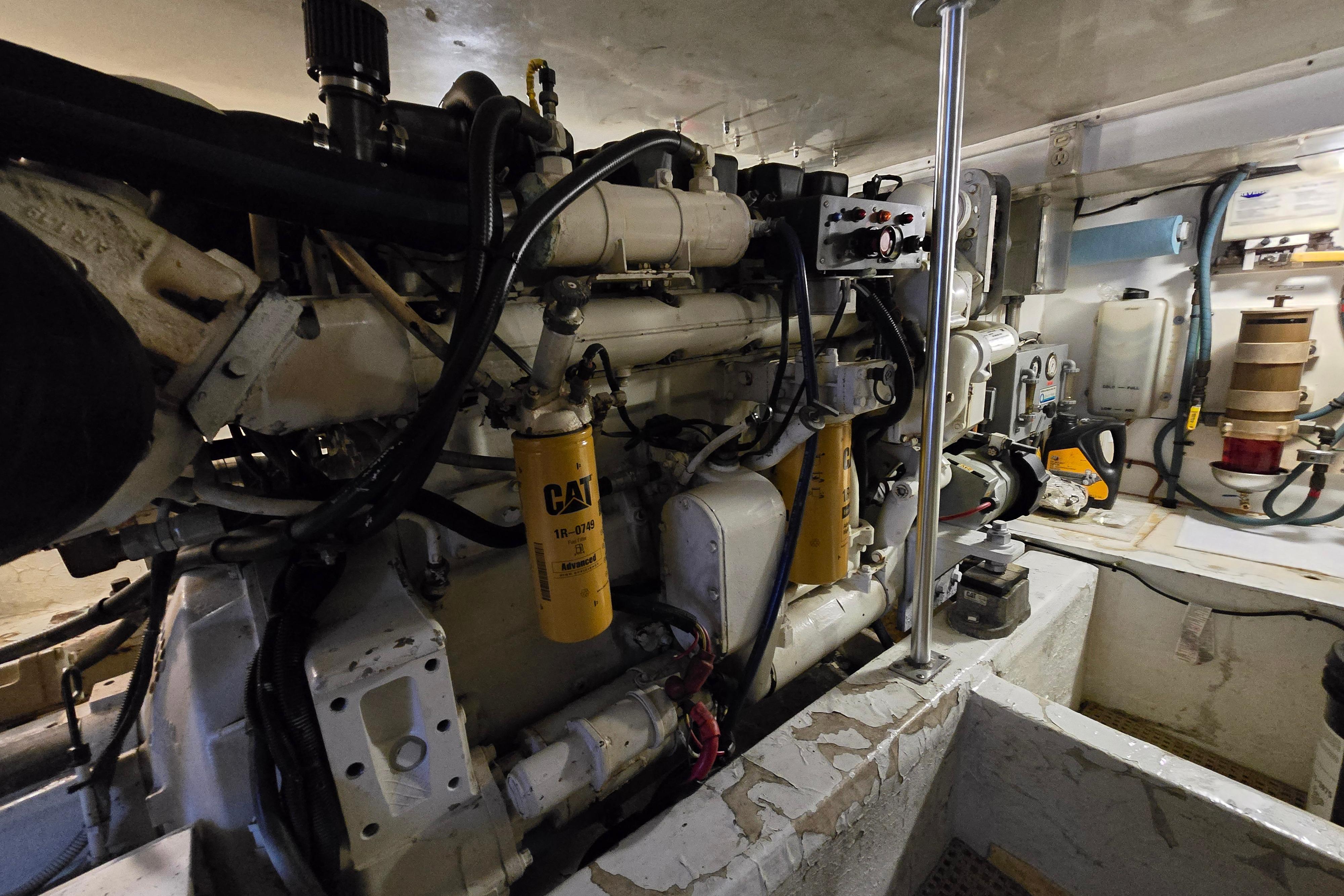 Engine room of a 2001 Cavileer 53 Convertible yacht, featuring CAT machinery.