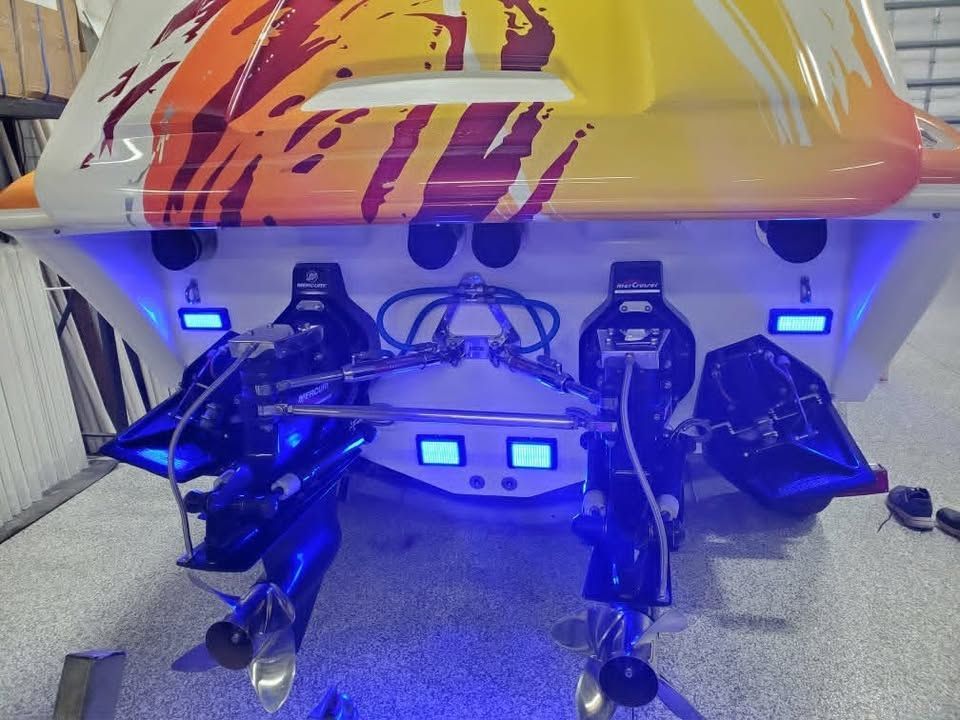 Rear view of 2003 Sunsation 32 Dominator with blue lighting.