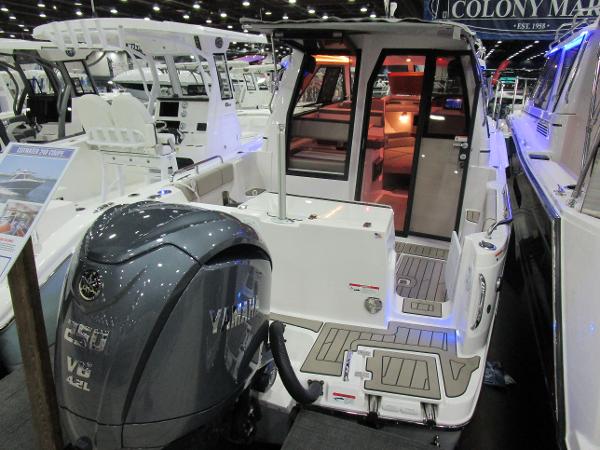 2025 Cutwater C-248 Coupe boat with Yamaha V6 engine at a boat show.
