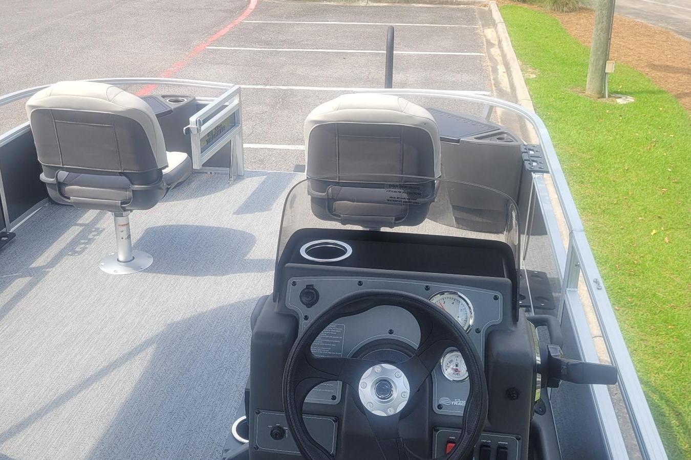 2026 Sun Tracker Bass Buggy 18 DLX interior with steering wheel and seating.