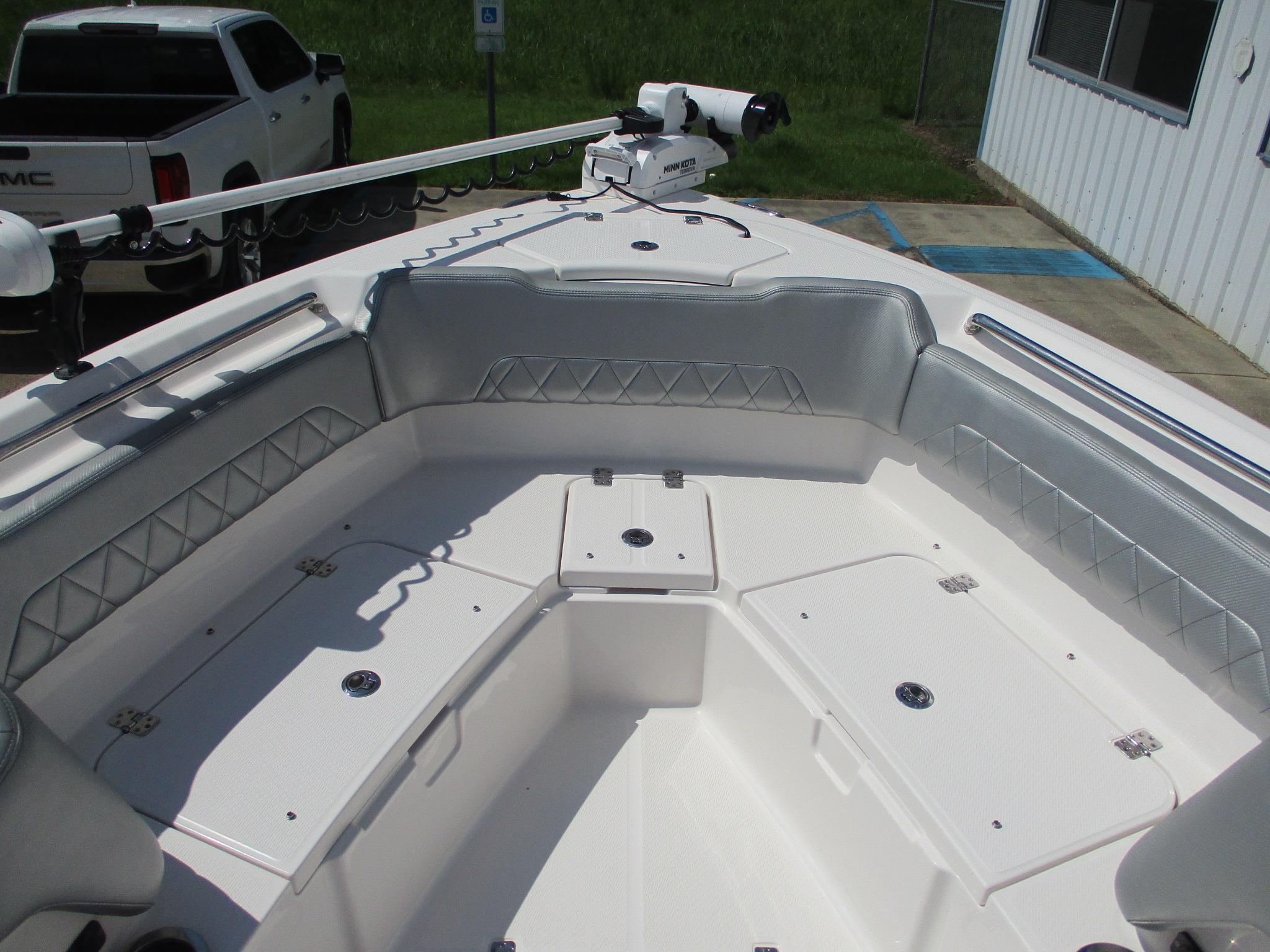 2024 Blue Wave 2800 Makaira boat interior with seating and storage compartments.