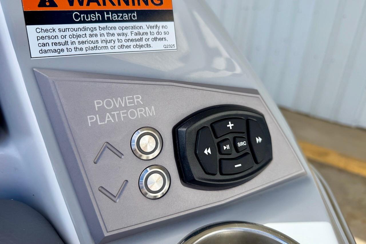 Control panel of 2025 Tigé Ultré 25ZX boat with warning label and buttons.