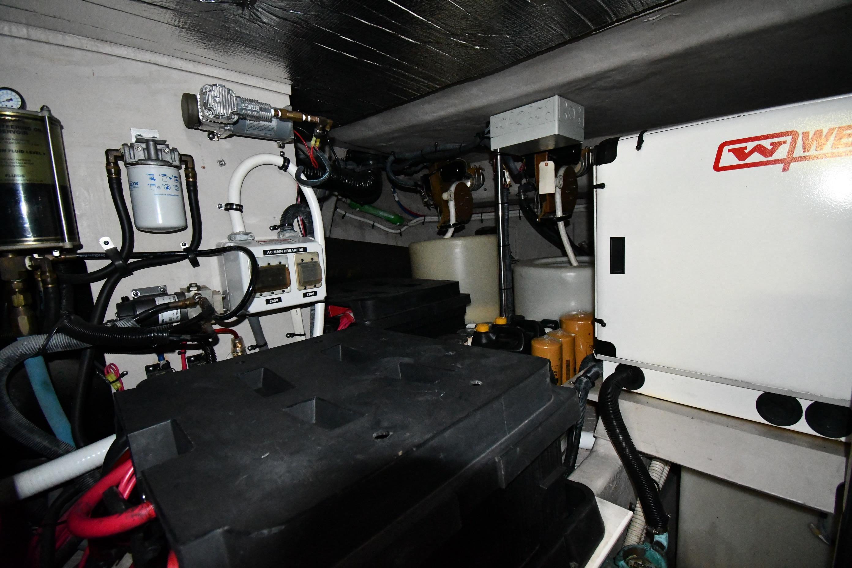 Engine room of 2001 Sea Ray 540 Sundancer with mechanical components and wiring.