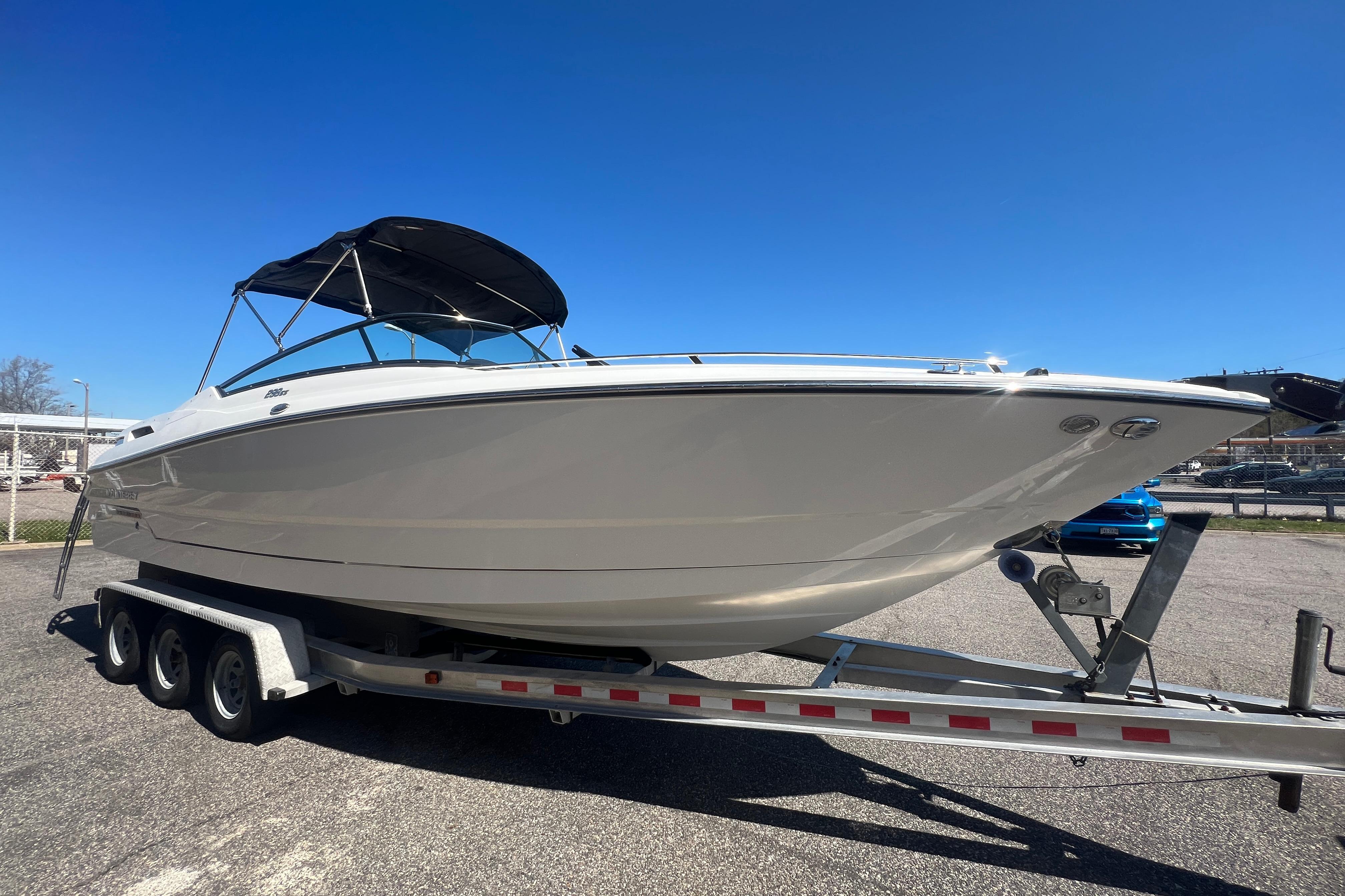 2017 Monterey 298SS Super Sport boat on trailer under clear blue sky.