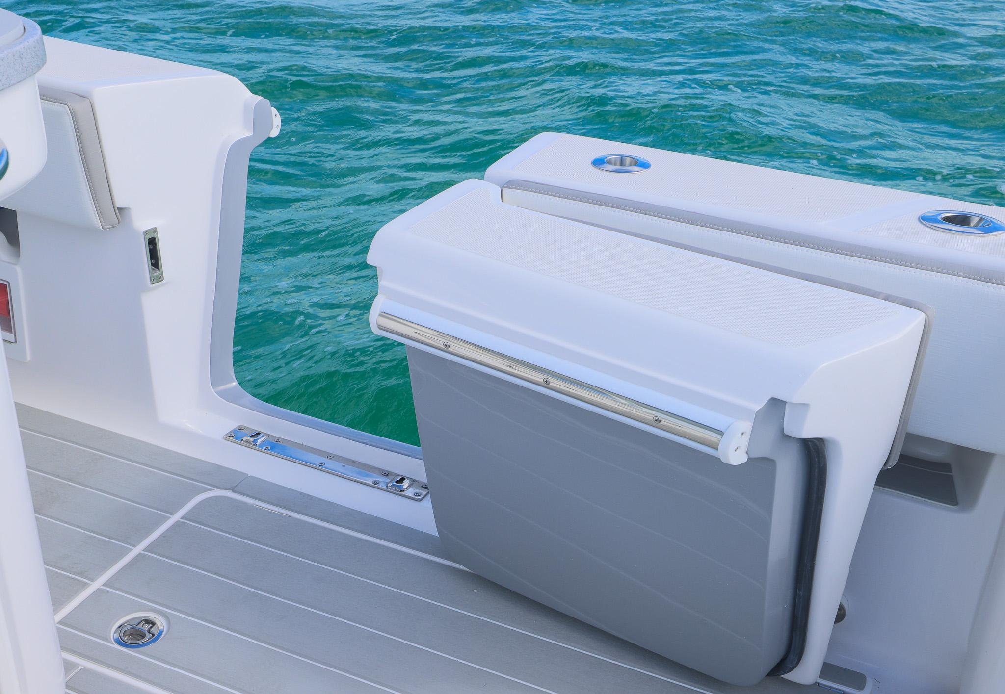 2025 Blackwater 43 Sportfish boat with foldable seat, overlooking clear blue water.