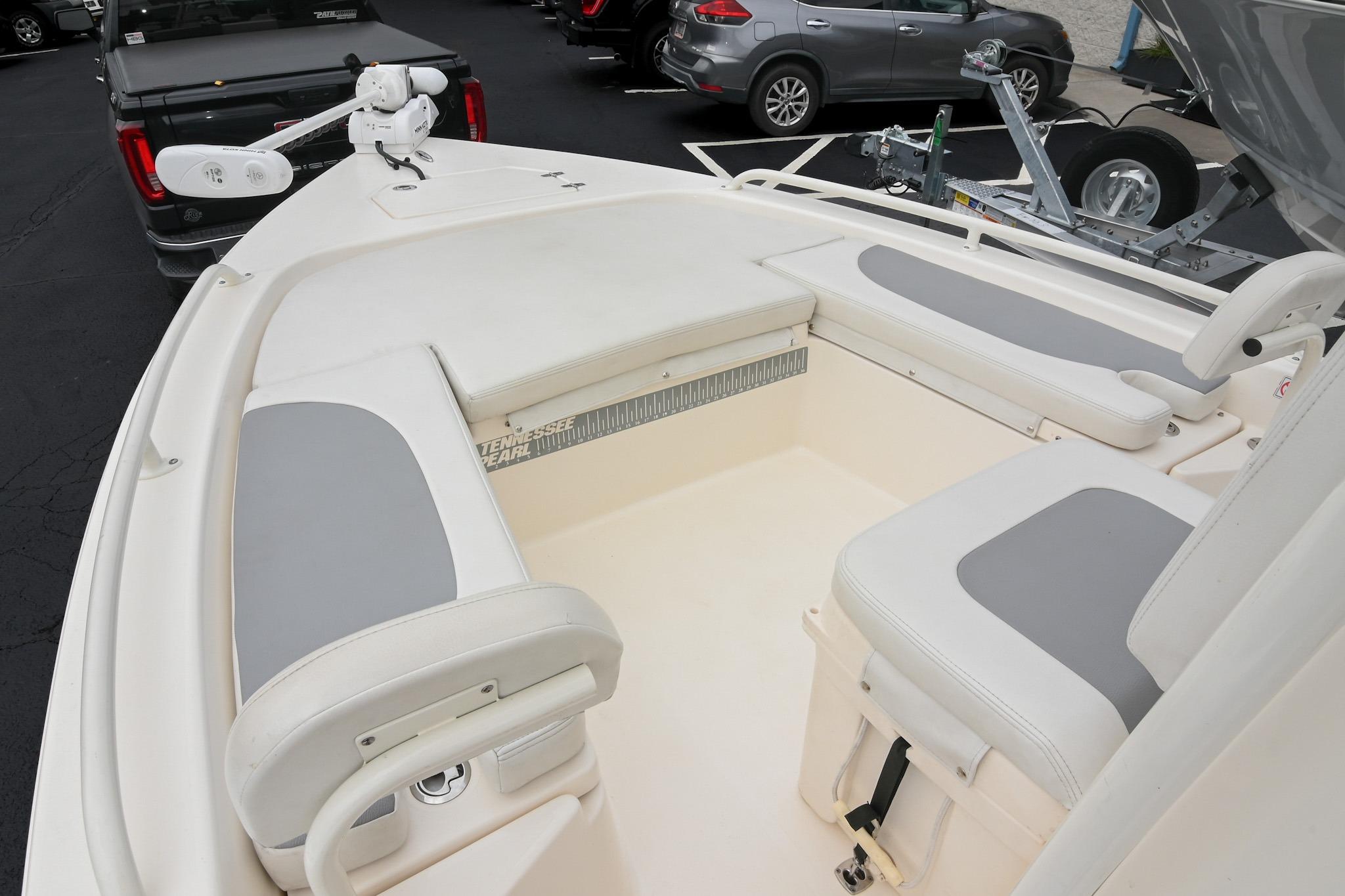 2021 Pathfinder 2200 TRS boat interior with cushioned seating and fishing gear.
