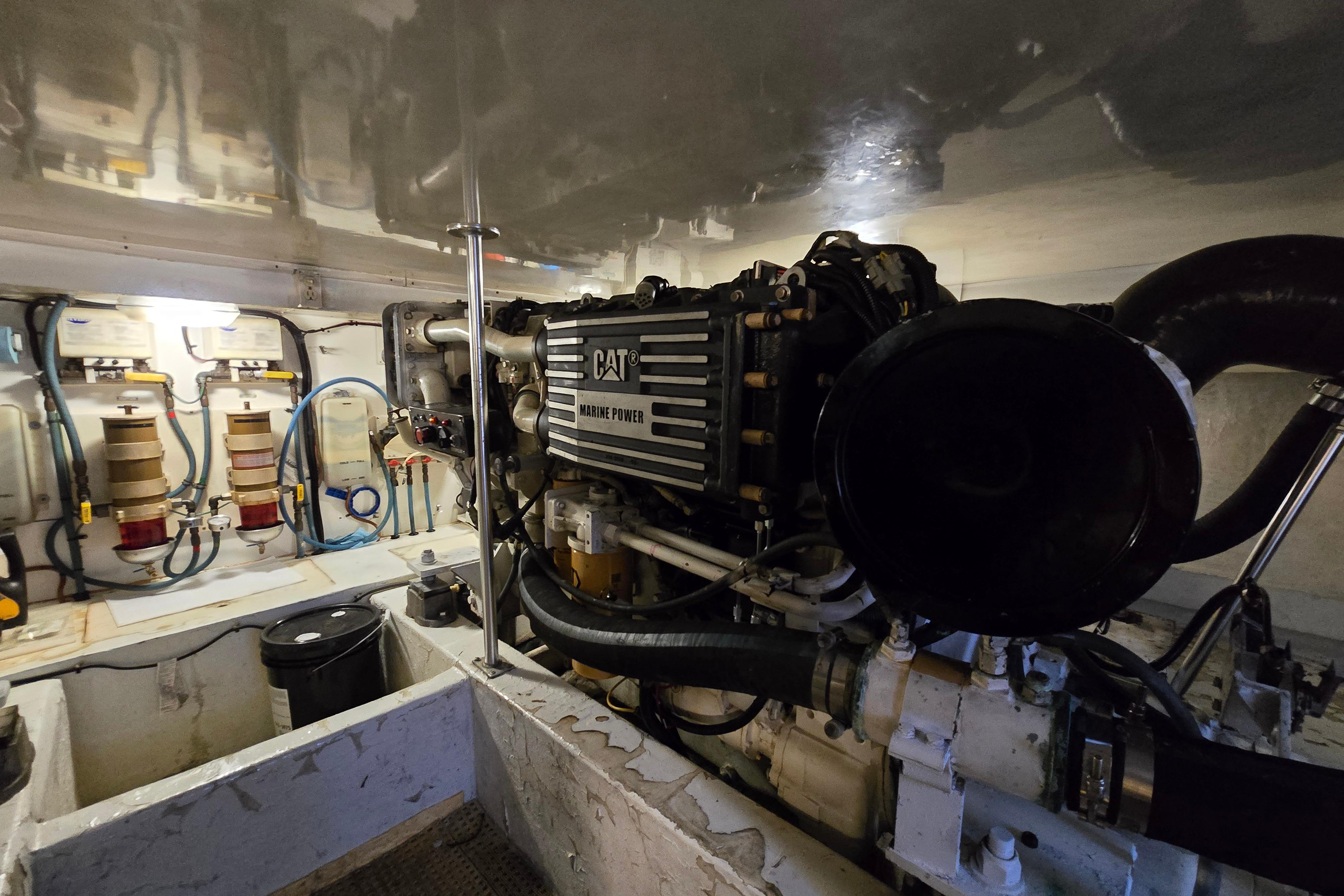 Engine room of 2001 Cavileer 53 Convertible with CAT marine power engine.