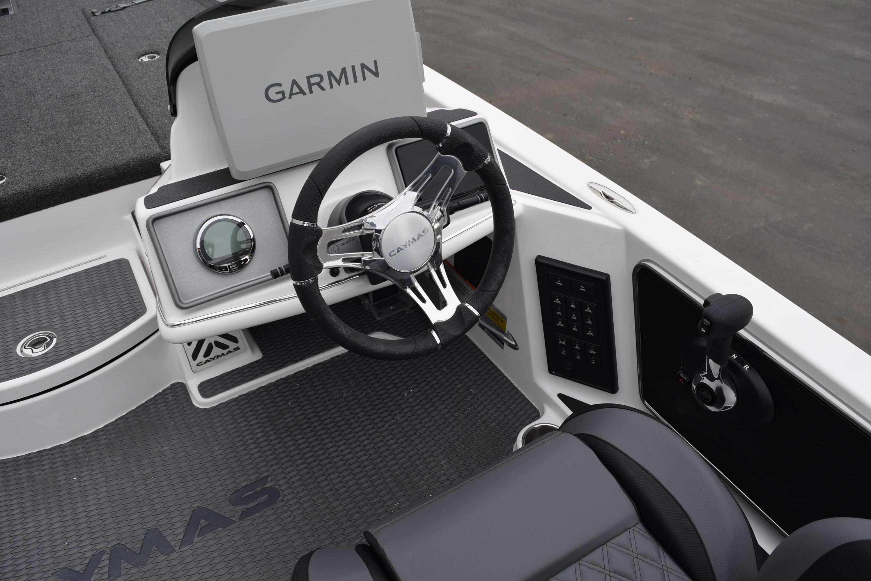 2027 Cayams CX 20 Pro boat cockpit with Garmin navigation and sleek steering wheel.