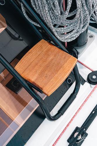 Deck detail of 2025 Nautitech 40 Open catamaran with wooden step and coiled rope.