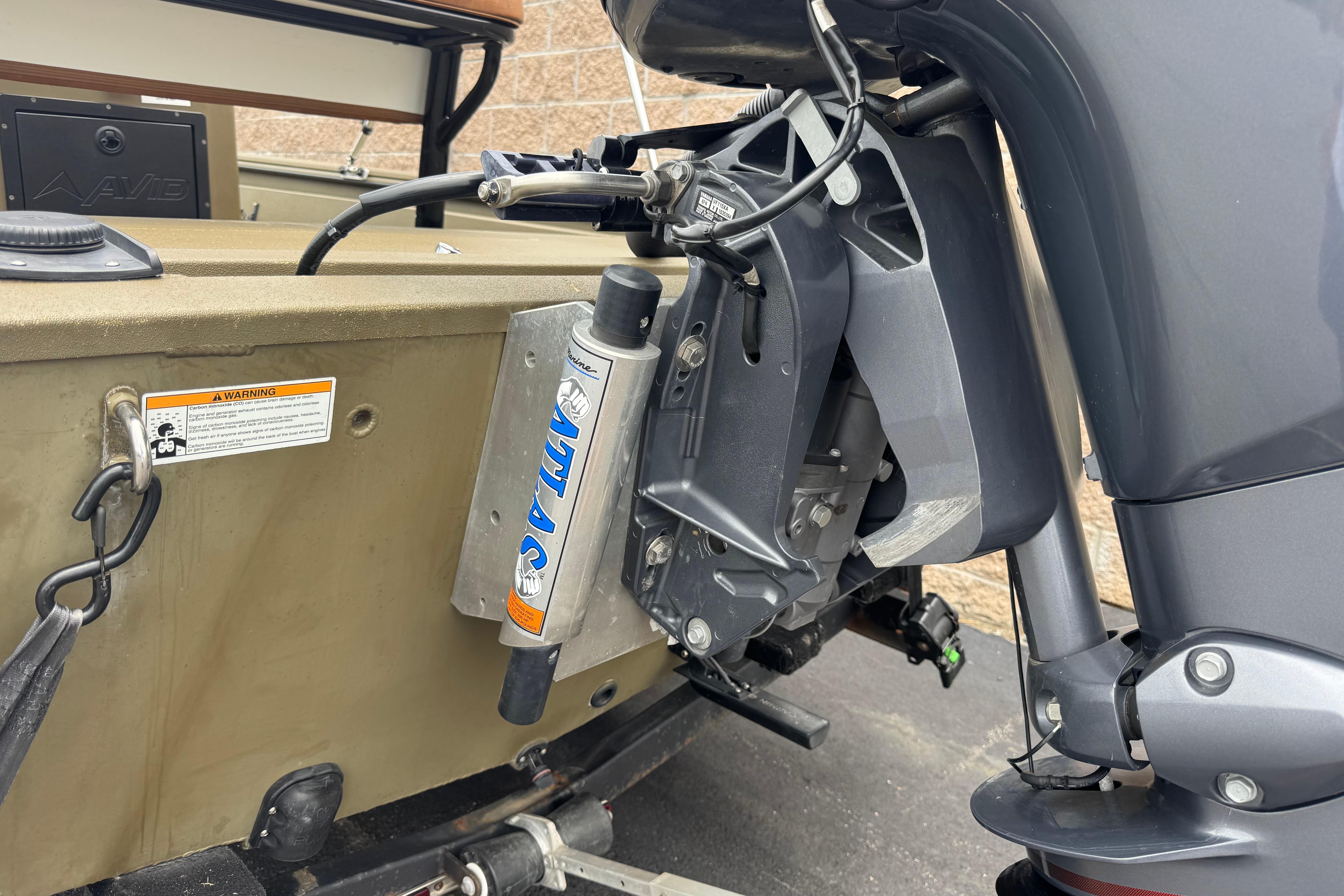 2023 Avid 18 Rogue CC boat motor and hydraulic system close-up.